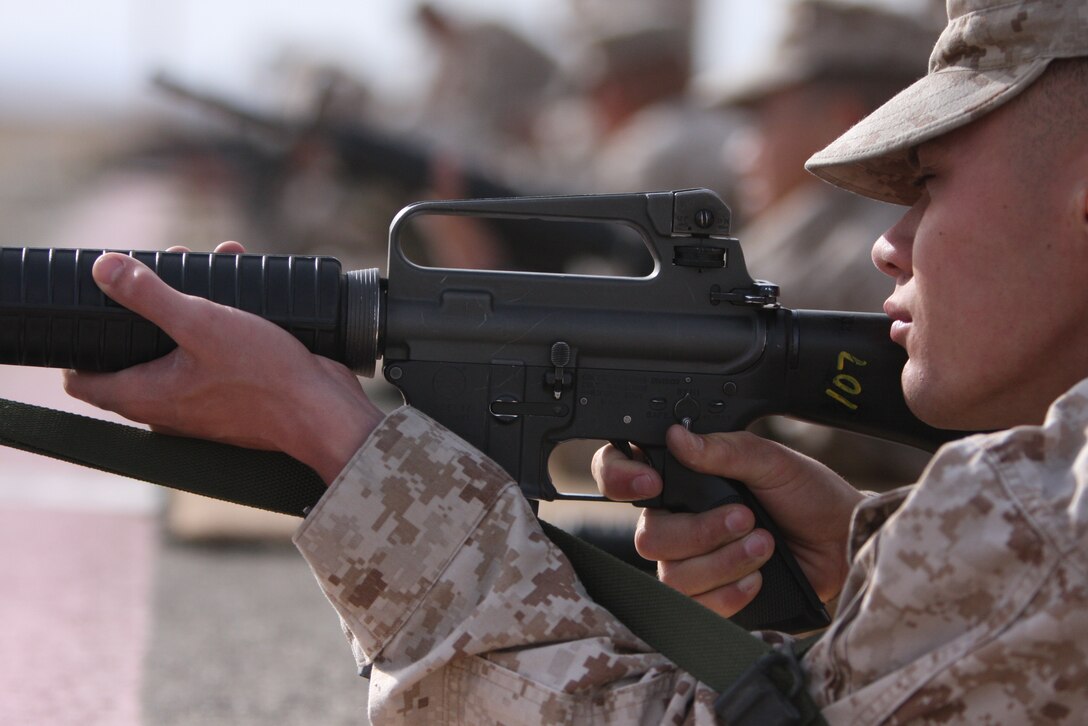 Cpl. Travis Walto, an aircraft electrical systems technician with Marine Wing Support Squadron 374, fires a shot on the 500 yard line during a Combat Marksmanship Coaches course at the Combat Center’s Rifle Range in May. As summer creeps closer, qualifying Marines run into more elemental obstacles on the firing line.