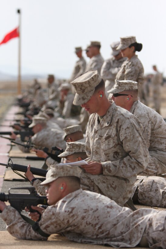 Cpl. Travis Walto, an aircraft electrical systems technician with Marine Wing Support Squadron 374, fires on the rifle range during the cooler days of early May. When temperatures rise, it means more work for qualifying shooters in the summer months.