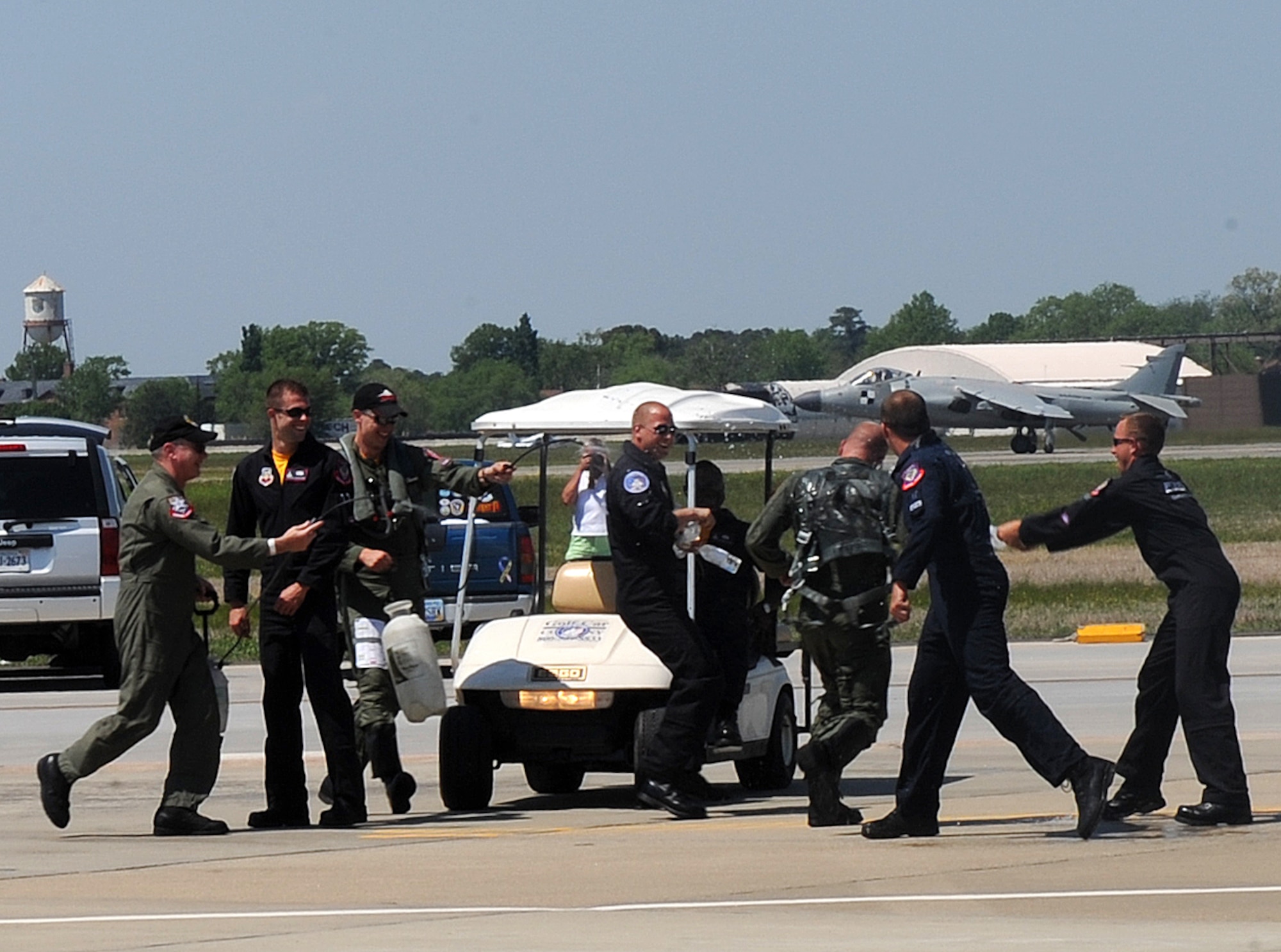 LANGLEY AIR FORCE BASE, Va. -- Capt. Sam Joplin, F-15 West Coast Demo Team pilot, is hosed down by Air Combat Command demo team members at AirPower Over Hampton Roads April 26.  This was the final public flight of the F-15 West Coast Demo Team after 26 years of performances. (U.S. Air Force photo/Airman 1st Class Zachary Wolf)
