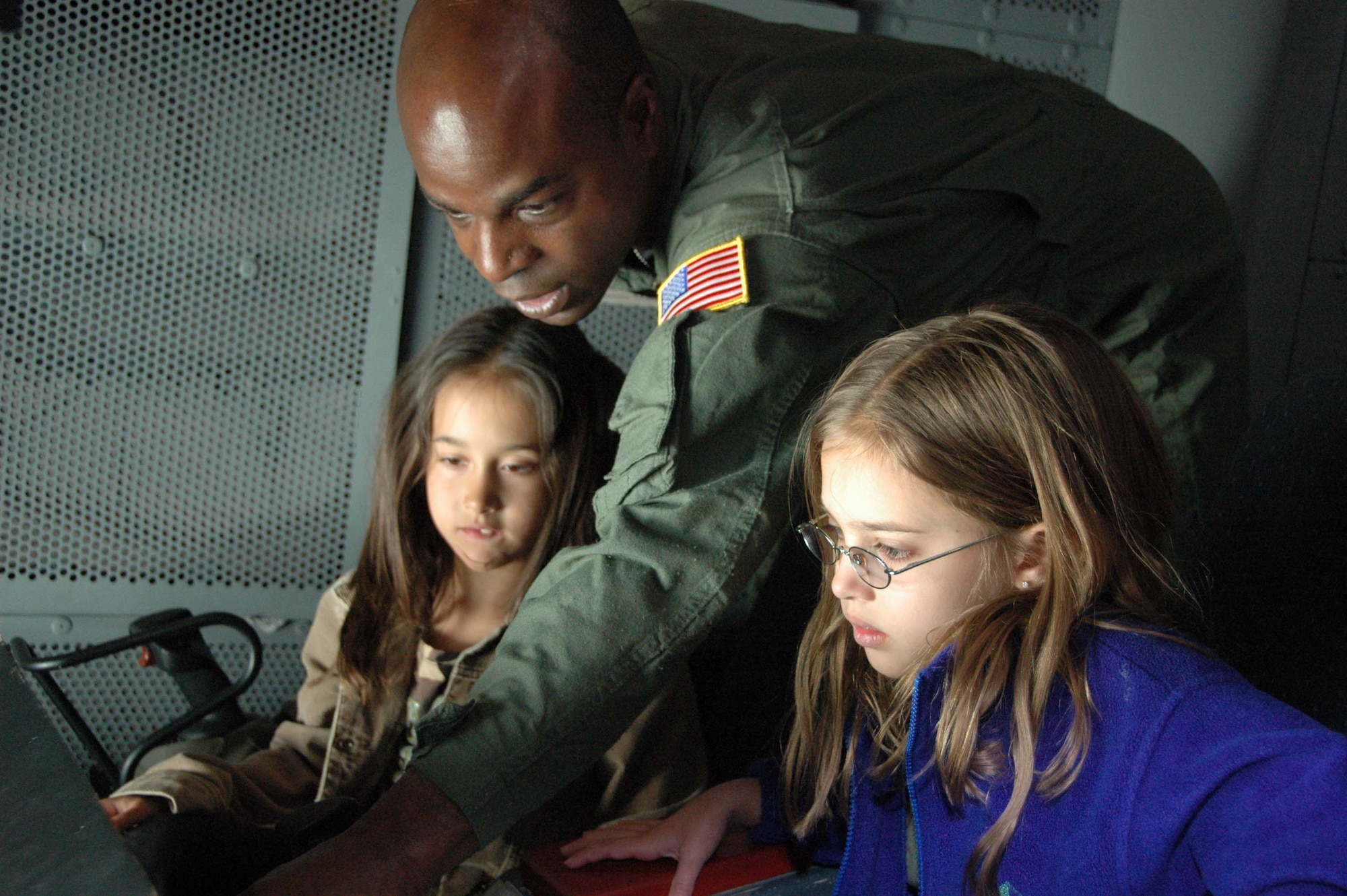 MCGUIRE AIR FORCE BASE, N.J. -- Tech. Sgt. Kevin Howard a Reseve boom operator provided instruction on in-flight refueling to more than 50 Citizen-Airmen children who participated in the 2009 Bring Your Sons and Daughters to Work event held April 23 at McGuire Air Force. In addition to seeing their parent's work areas the children toured the C-17 and KC-10 aircraft and learned about the base's bird strike avoidance program during a visit to the Falcon Environmental Services section. (U.S. Air Force photo by/Master Sgt. Donna T. Jeffries)