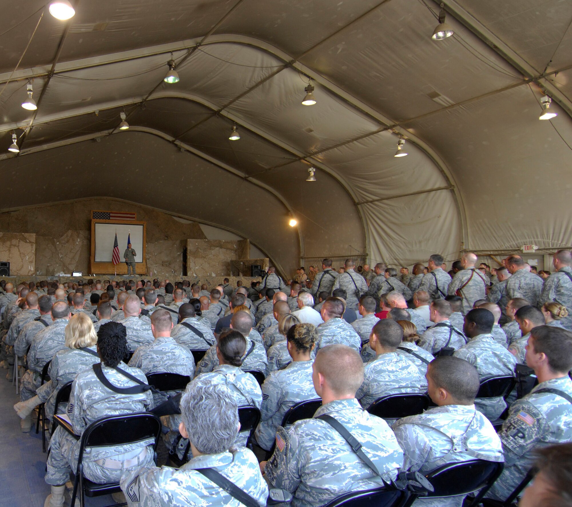 Col. Steven Kwast, 455th Air Expeditionary Wing commander, addresses hundred?s of Airmen at Bagram Air Field, Afghanistan, April 23. The four elements he addressed for all Airmen to instill in themselves: have humility, be noble, be a warrior and have compassion. ?Having those traits are key to achieving the two goals outlined by the commander, which is to win and be prepared for the unexpected.? (U.S. Air Force photo/ Senior Airman Erik Cardenas)(Released) 