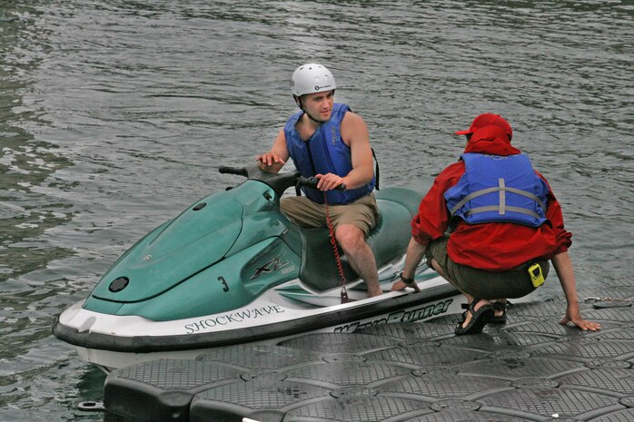 A rider is pulled toward the dock after going on a free Jet Ski ride at the season opening of Fish Tales Marina here April 25. The minimum age to operate a Jet Ski is 16. All riders must first complete a brief training class before hitting the water.