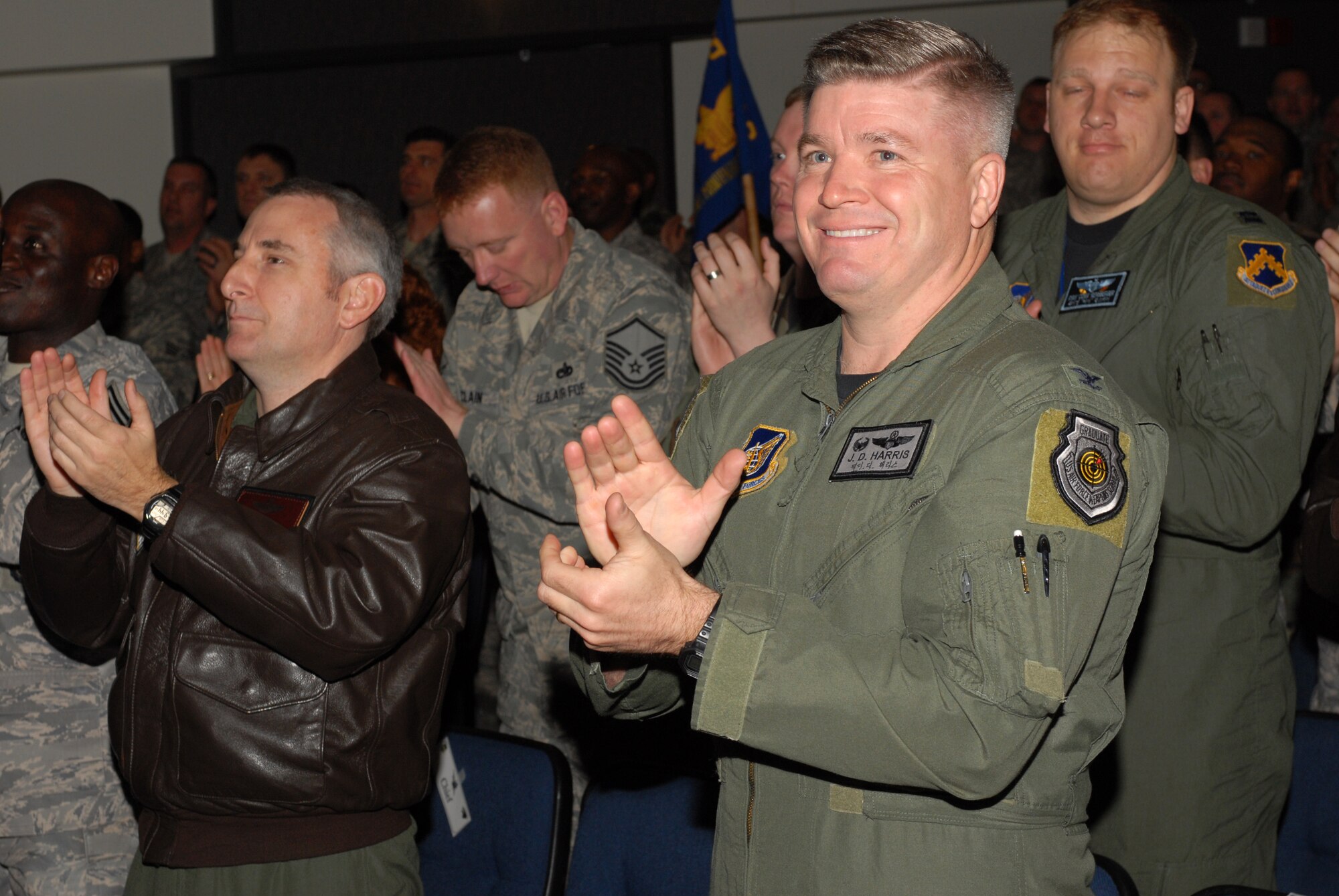Colonel Jerry D. Harris, 8th Fighter Wing commander, shows his excitement upon hearing the Wing's Excellent grade during the Pacific Air Forces Operational Readiness Inspection out-brief at Kunsan Air Base, Republic of Korea, April 28, 2009. The PACAF Inspector General's staff conducted the ORI out-brief to present the results gathered from the April 19-24 inspection.(Photo by Senior Airman Gustavo Gonzalez)