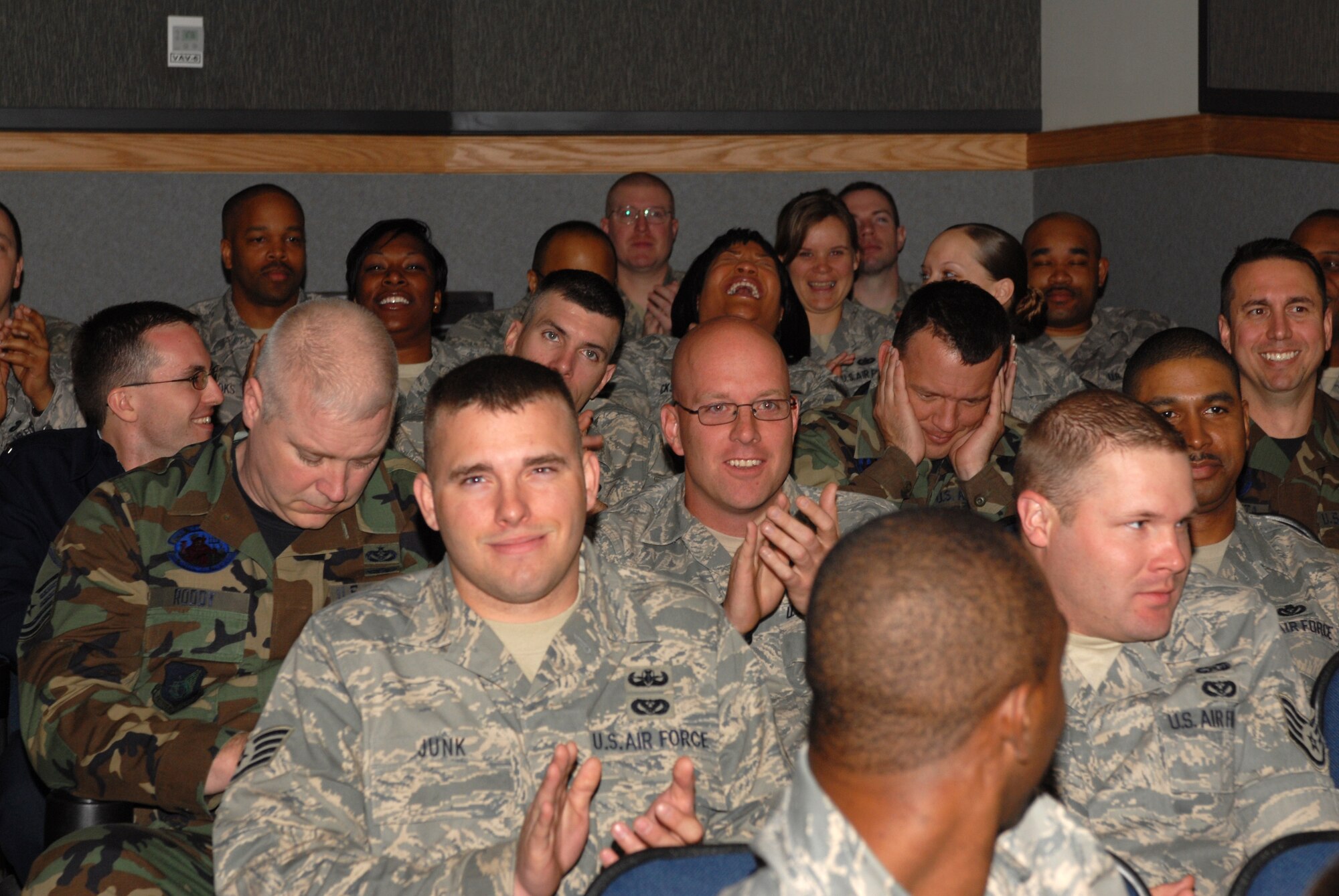 Airmen of the 8th Fighter Wing express their excitement for the Pacific Air Forces Operational Readiness Inspection grade during the ORI out-brief at Kunsan Air Base, Republic of Korea, April 28, 2009. The PACAF Inspector General's staff conducted the ORI out-brief to present the results gathered from the April 19-24 inspection. (Photo by Senior Airman Gustavo Gonzalez)