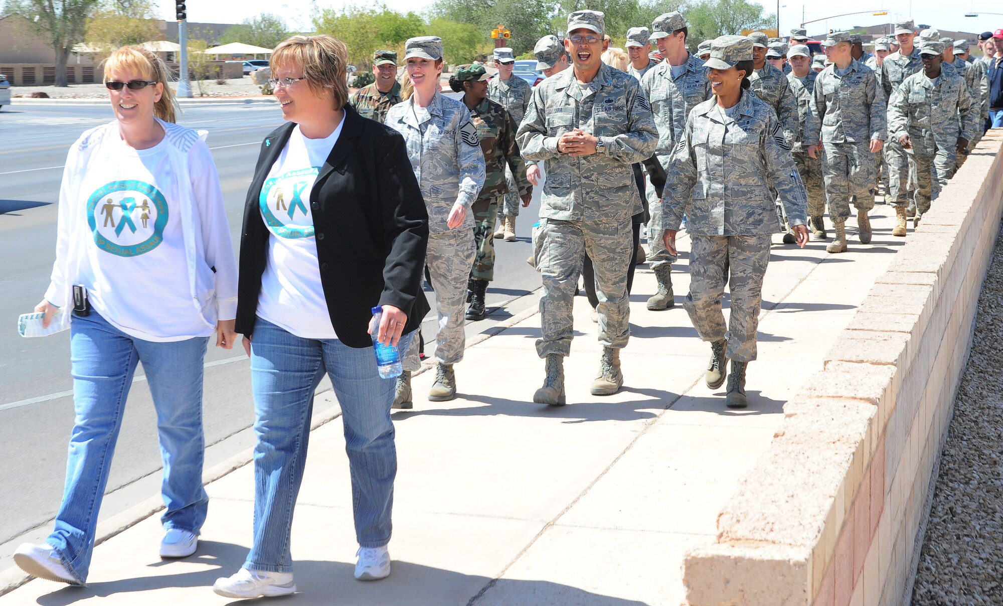 Holloman Air Force Base personnel participate in the 1st annual "My Strength is for Defending" Walk for Sexual Assault Awareness, April 17. Air Force Chief of Staff Gen. Norton Schwartz identified sexual assault as a "direct responsibility of commanders and a collective responsibility of our community of Airmen." The walk was one of many events that took place during Sexual Assault Awareness Month. (U.S. Air Force photo/ Airman 1st Class DeAndre Curtiss)


