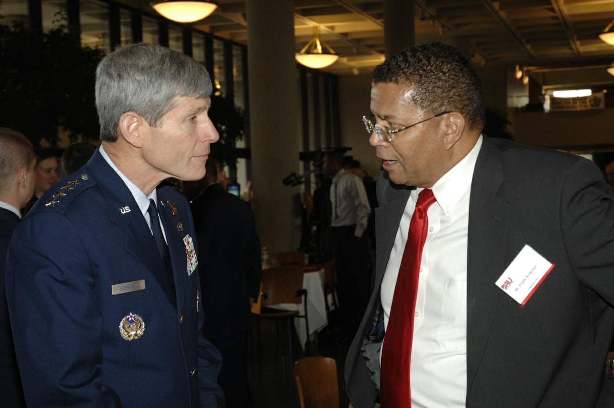Mr. Frank Anderson, president of Defense Acquisition University, chats with Gen. Norton Schwartz, Air Force chief of staff, April 21 during DOD Acquisition Insight Days at Sinclair Community College in Dayton, Ohio. The event featured workshops, training and a forum for Air Force acquisition professionals to discuss the latest regulatory changes and ideas for speeding the delivery of new capabilities for joint warfighters. (U.S. Air Force photo/Al Bright)
