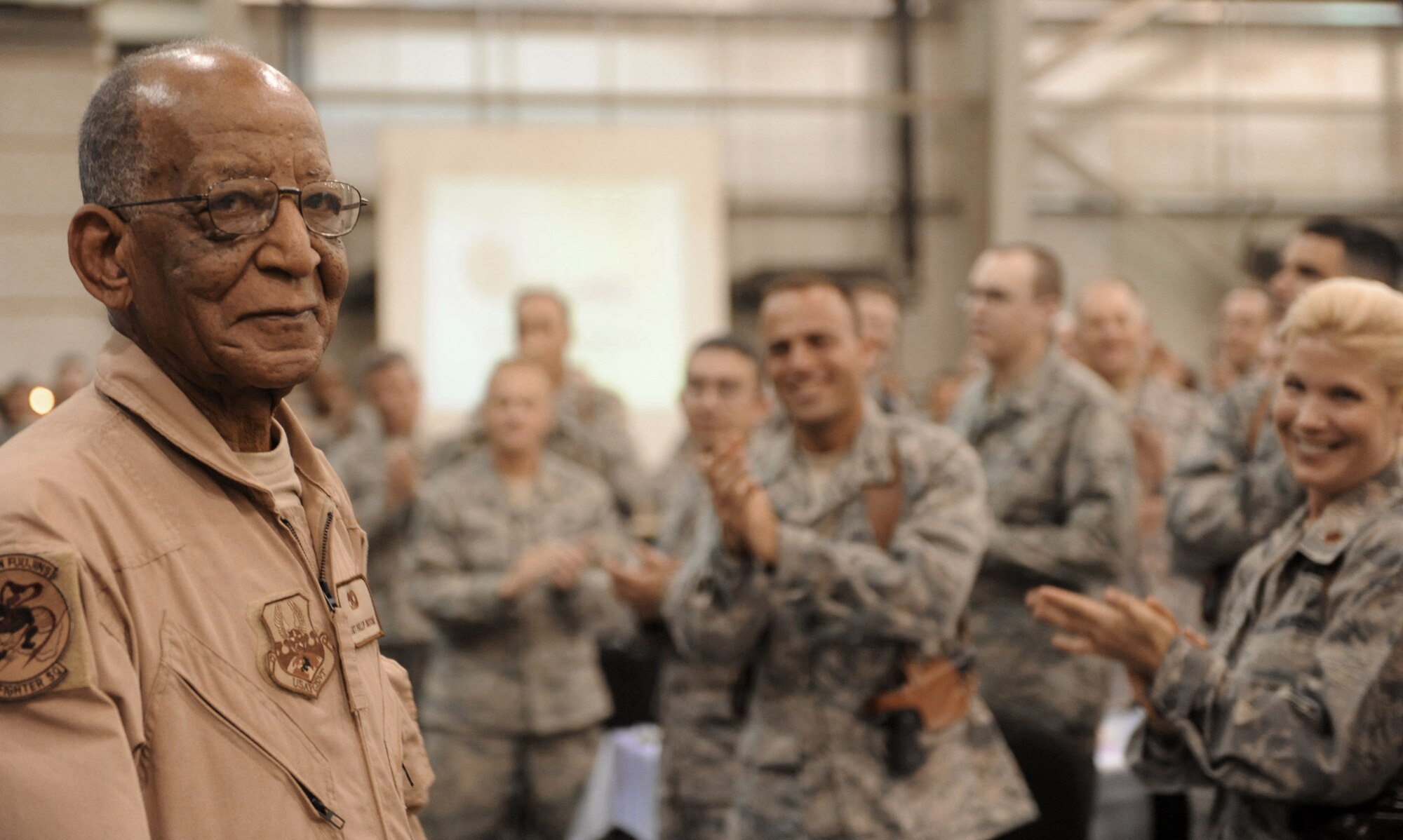 Former Staff Sgt. Phillip Broome, a Tuskegee Airman, smiles as the audience sings "Happy Birthday" at the combat dining-in for the 332nd Air Expeditionary Wing at Joint Base Balad, Iraq.  He will mark his 90th birthday next month. (U.S. Air Force photo/Senior Airman Elizabeth Rissmiller)