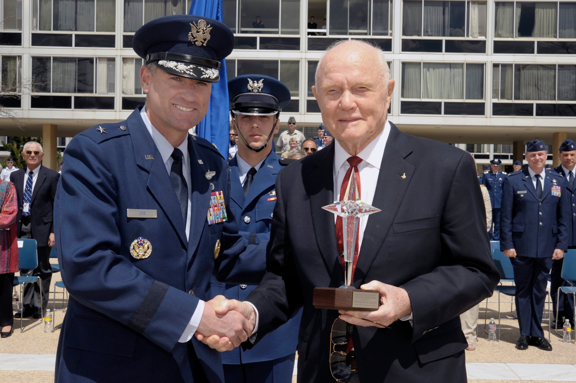 Sen. John Glenn accepts the 2008 Thomas D. White National Defense Award from Commandant of Cadets Brig. Gen Samuel Cox during a ceremony April 22 on the U.S. Air Force Academy terrazzo.  (U.S. Air Force photo/Mike Kaplan)