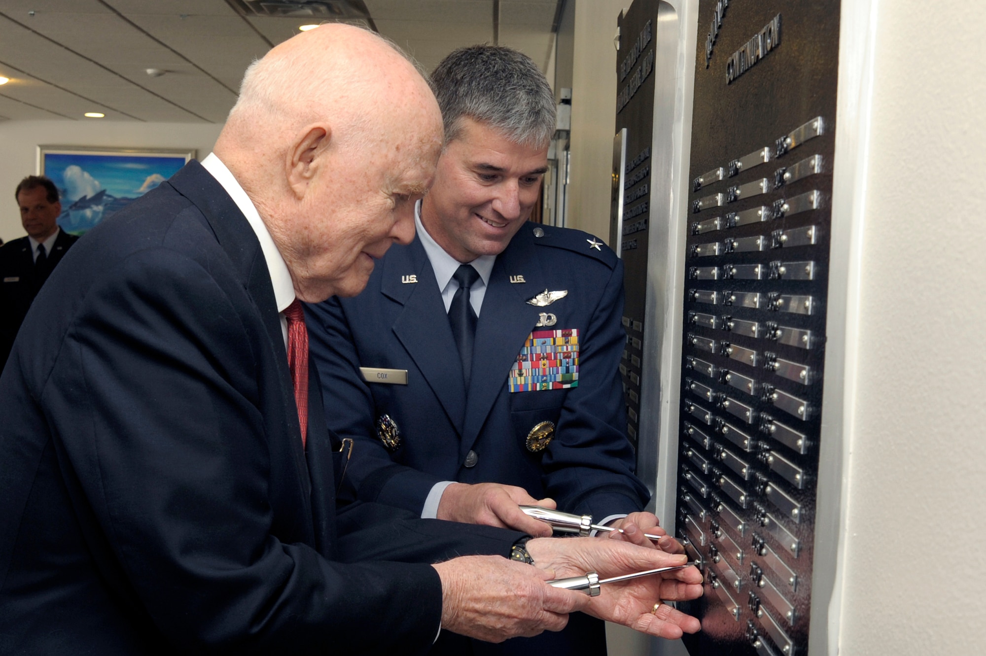 Sen. John Glenn and Commandant of Cadets Brig. Gen Samuel Cox mount the name plate for Senator Glenn April 22 as the recipient of the 2008 Thomas D. White National Defense Award. He was at the Academy for the award presentation.  (U.S. Air Force photo/Mike Kaplan)