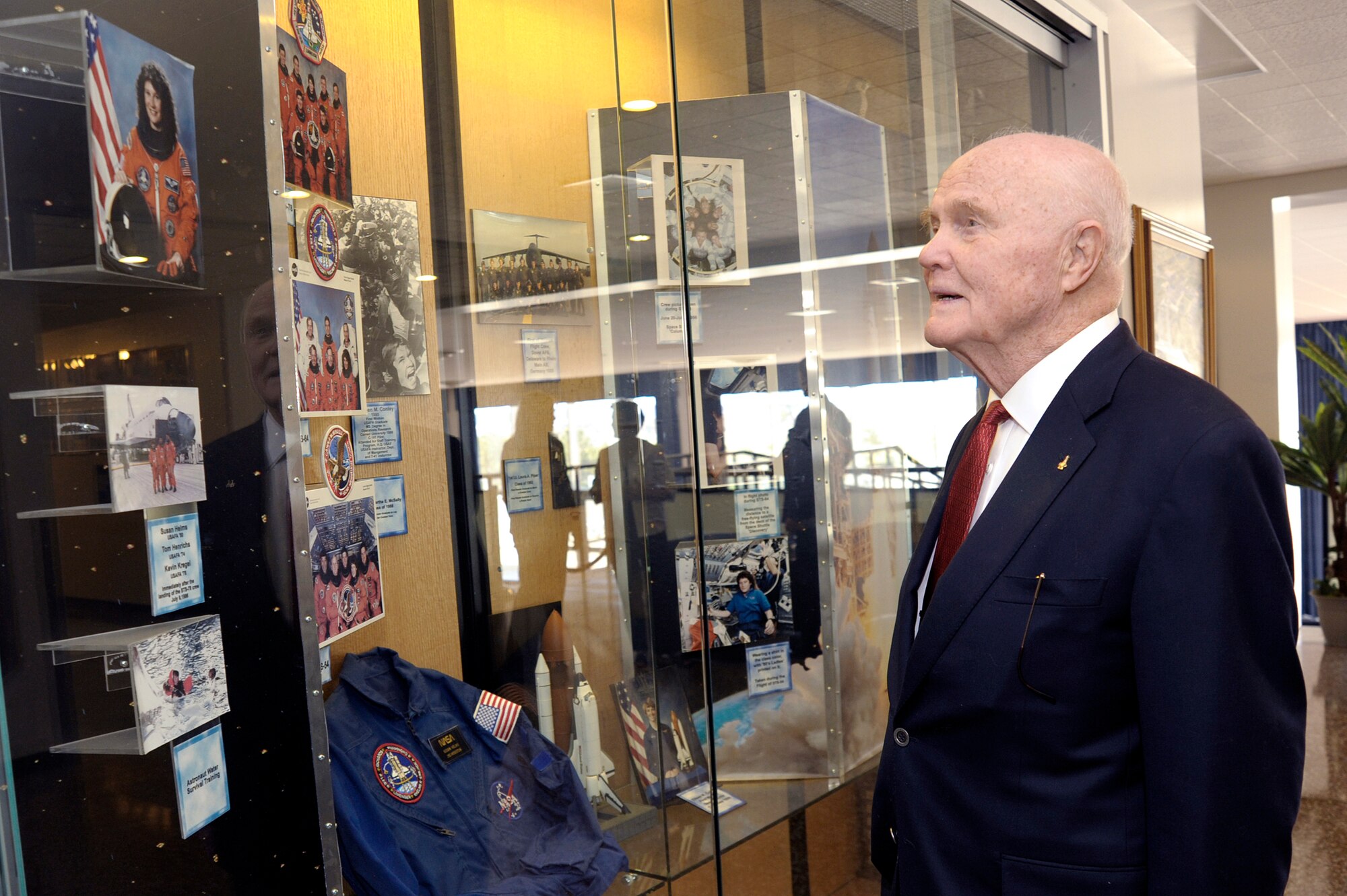 Sen. John Glenn admires a display case April 22 featuring U.S Air Force Academy graduate Brig. Gen. Susan J.  Helms.  He was visiting the Academy to be honored as the recipient of the 2008 Thomas D. White National Defense Award.  (U.S. Air Force photo/Mike Kaplan)