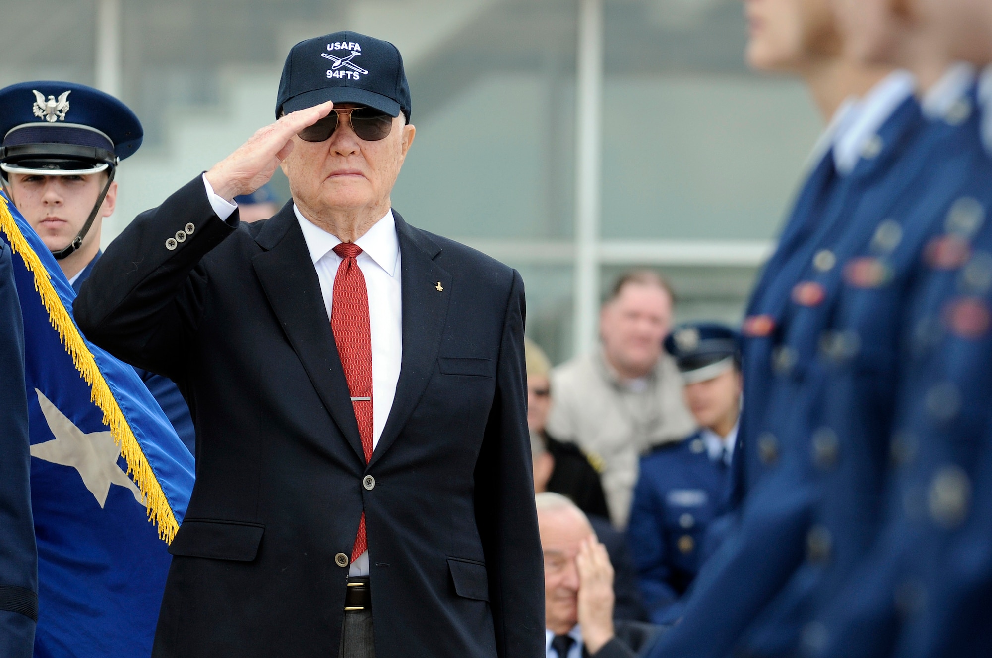 Sen. John Glenn salutes the color guard during the noon meal parade April 22 on the U.S Air Force Academy's terrazzo.  He was visiting the Academy to be honored as the recipient of the 2008 Thomas D. White National Defense Award.  (U.S. Air Force photo/Mike Kaplan)