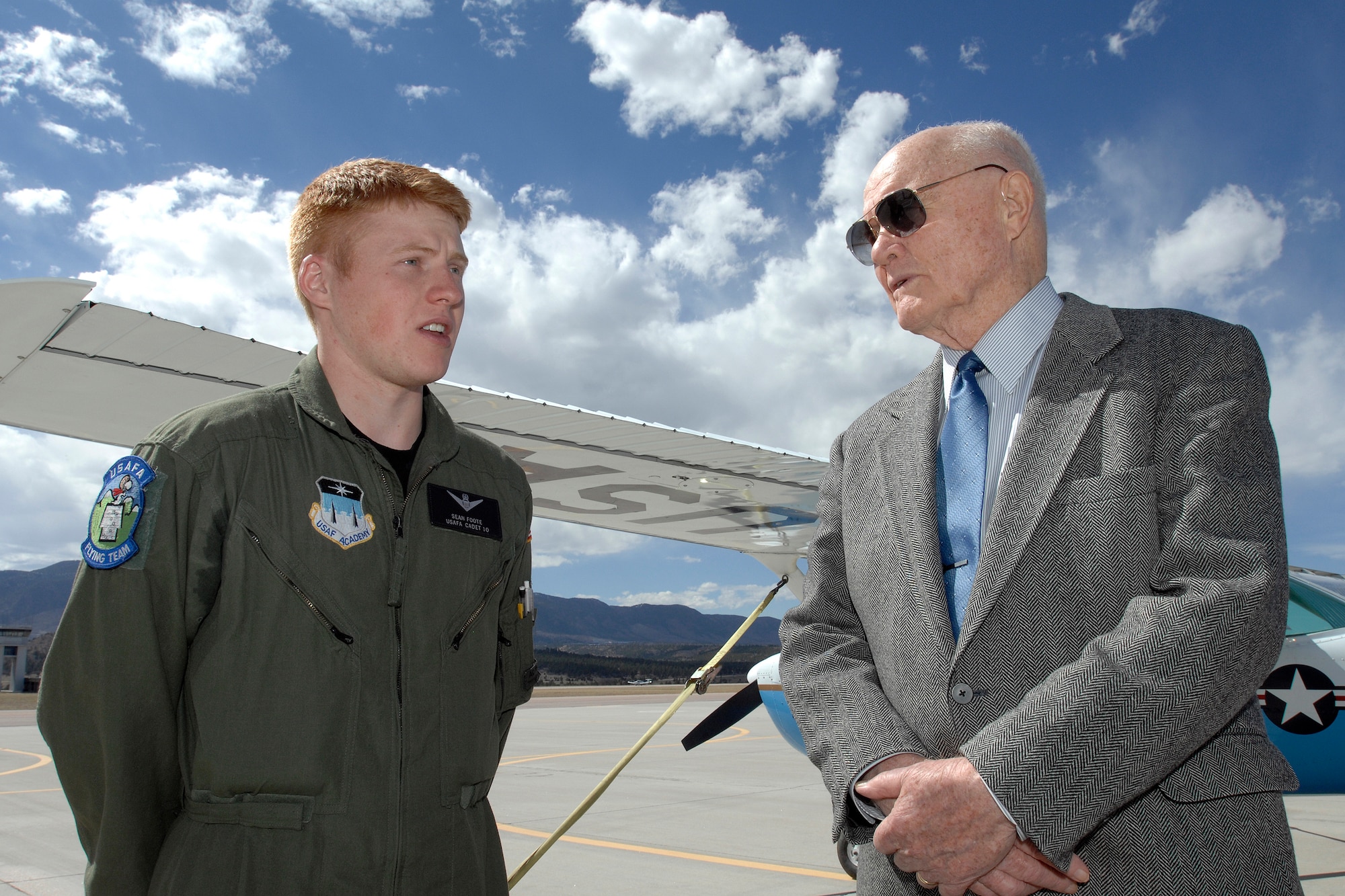 Cadet 2nd Class Sean Foote briefs Sen. John Glenn about the T-51A trainer on the U.S Air Force Academy airfield April 21.  During the senator's 3-day visit, he was honored as the recipient of the 2008 Thomas D. White National Defense Award on the Academys terrazzo in front of the cadet wing.  (U.S. Air Force photo/Dennis Rogers)