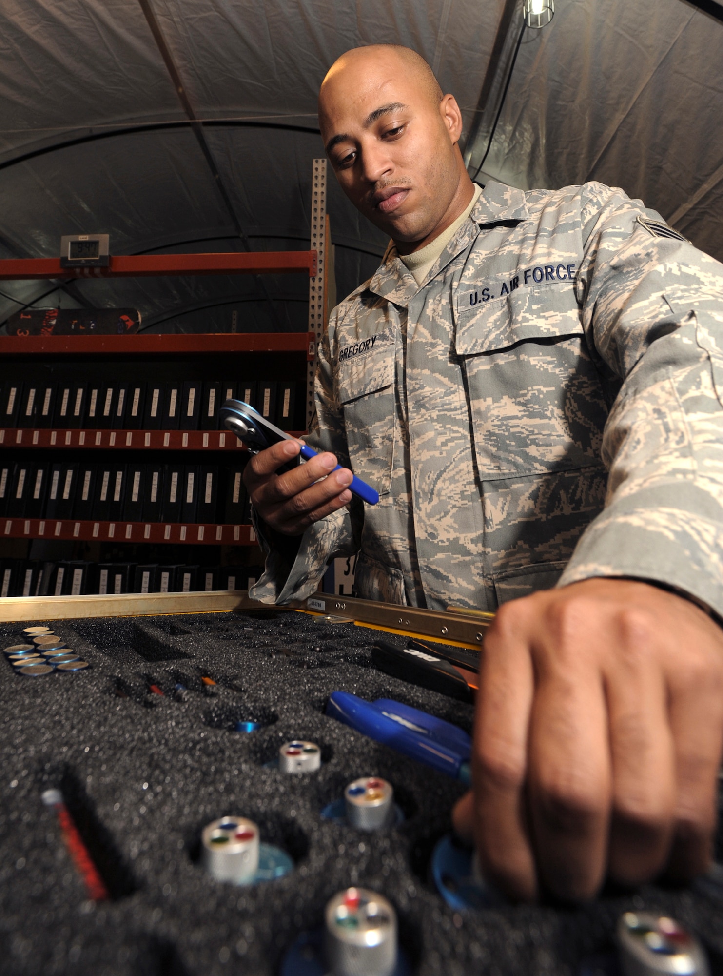 Staff Sgt. Ivan Gregory performs a 60-day inspection on a Daniels Tool Kit April 20 at an air base in Southwest Asia. The tool kit, which is used to repair wires on an aircraft, is inspected periodically to ensure it is functioning properly. Sergeant Gregory is a 746th Aircraft Maintenance Unit avionics technician. (U.S. Air Force photo/Staff Sgt. Joshua Garcia) 
