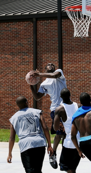 MOODY AIR FORCE BASE, Ga. -- Airmen play on an outside rim in a 3-on-3 basketball tournament during Airmen Appreciation Day here April 24. (U.S. Air Force photo by Airman 1st Class Joshua Green) 