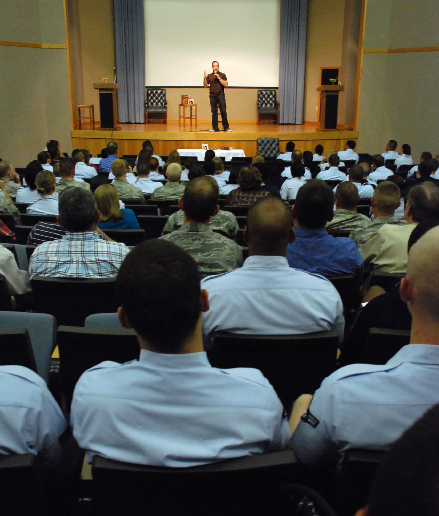 LAUGHLIN AIR FORCE BASE, Texas –– Bernie McGrenahan, a comedian who has been on Davis Letterman, Comedy Central and is featured in the No. 1 selling comedy book ‘I Killed,’ shares a piece of his life story with Laughlin Airmen here April 20. His comedy sketch helped to help support Sexual Assault Awareness Month. McGrenahan came to Laughlin as a part of his national “Happy Hour” tour, in an effort to help promote responsible decision-making in young Airmen. (U.S. Air Force photo by Airman 1st Class Sara Csurilla)