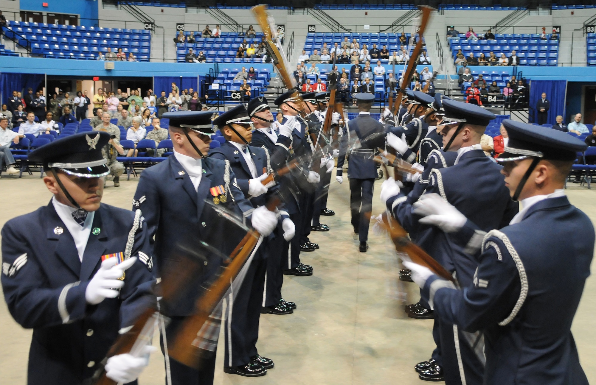 The U.S Air Force Honor Guard Drill Team Performs at Hampton University to begin Air Force Week April 18 in Hampton Va.The Drill Team and The U.S Air Force Band's rock band Max Impact performed together for the first time in public after a few weeks of training and coordination on Maxwell AFB, Ala. Air Force week is full of activities and functions that allow non-military members to see the Air Force's mission, show their support, and  meet possible future Airmen. (U.S. Air Force photo by Senior Airman Alexandre Montes)