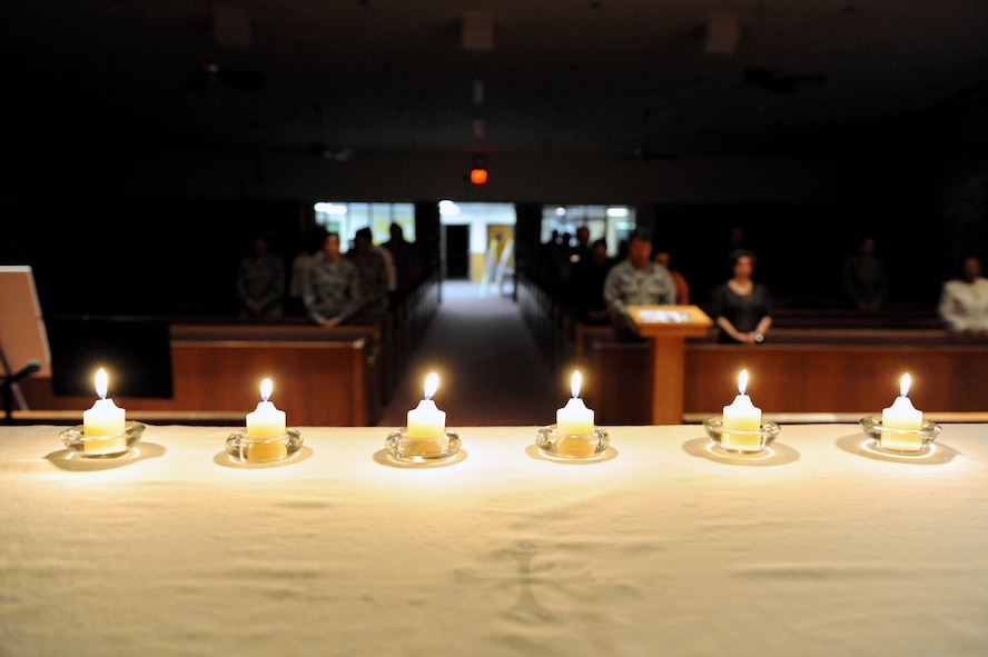 MOODY AIR FORCE BASE, Ga. -- Six candles burn on a table during the Holocaust Days of Remembrance ceremony held at the Chapel here April 21. Each burning candle represents one million victims who died or were tortured during the Holocaust.  (U.S. Air Force photo by Airman 1st Class Joshua Green) 
