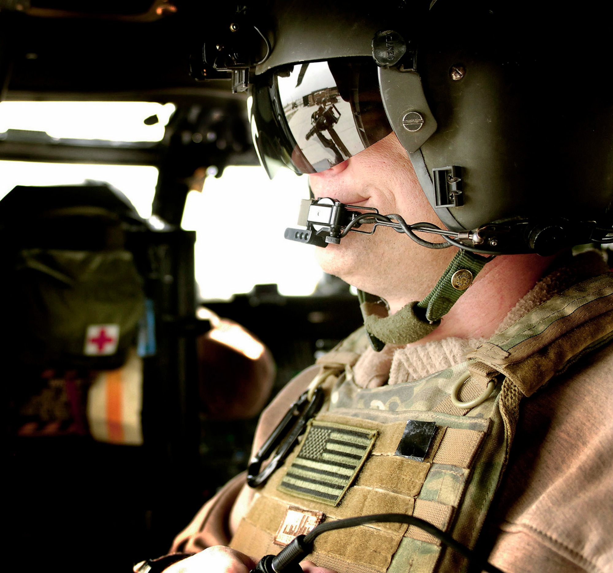 Senior Master Sgt. Glen Berg mans his HH-60 Pave Hawk rail gun before taking off on a training mission April 20 at Bagram Airfield, Afghanistan. Sergeant Berg is a 101st Expeditionary Rescue Squadron aerial gunner. (U.S. Air Force photo/Staff Sgt. Jason Lake) 
