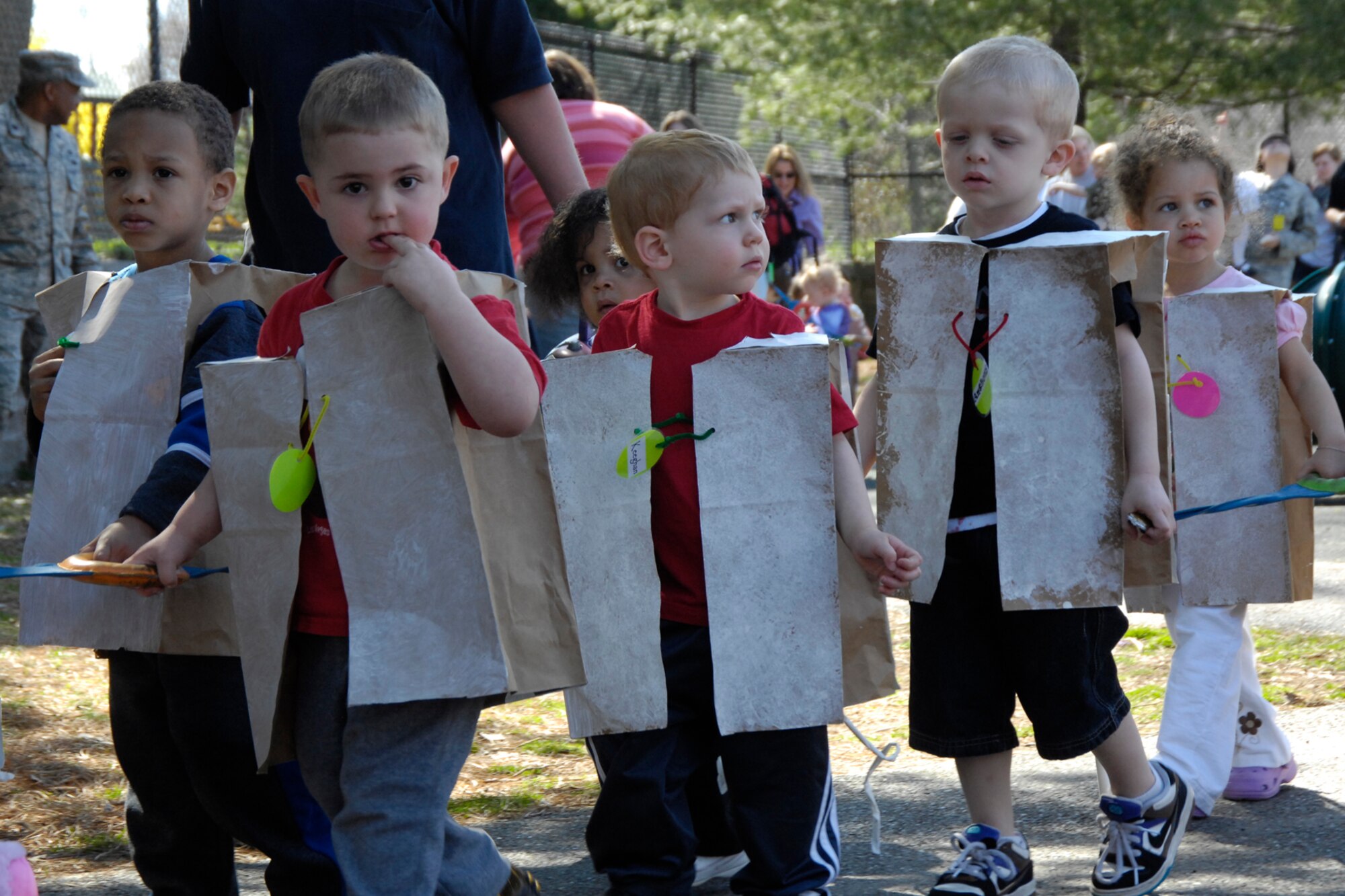 HANSCOM AIR FORCE BASE, Mass. – Hand in hand students dressed as dogs march to the beat of “Who Let the Dogs Out” during the Hanscom Child Development Center’s Fantastic Floats parade, April 24. (U.S. Air Force photo by Linda LaBonte Britt)