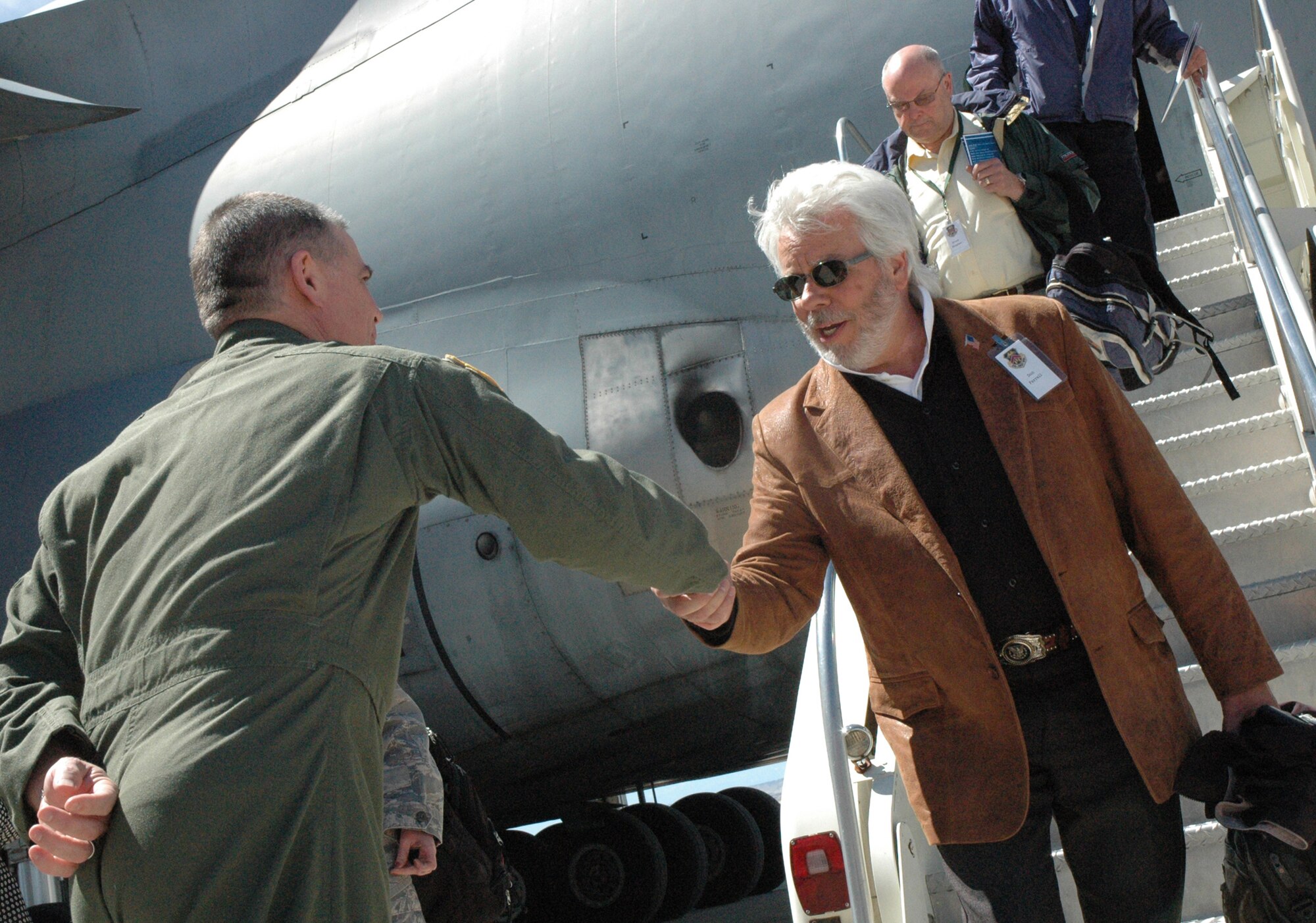 Col. Jack H. Pittman, Jr. (left) greets Don Ferrell of the 439th
Airlift Wing's Galaxy Community Council, and Massachusetts educators April
23 after their arrival in a 439th AW C-5A Galaxy for a community relations
tour to the 302nd Airlift Wing. The educators are on a two-day Air Force
Reserve Command community relations tour designed to aid them in gaining a
better understanding of the roles and missions of the Air Force Reserve. The
tour took the educators to the U.S. Air Force Academy as well as Schriever
and Peterson Air Force Bases. The 439th AW is based at Westover Air Reserve
Base, Mass. (U.S. Air Force photo/Senior Airman Stephen Collier)