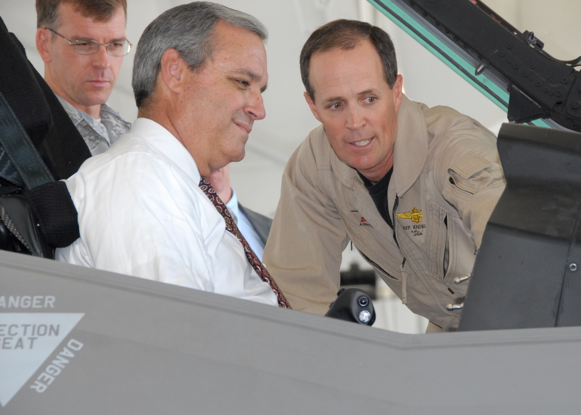 Florida Congressman, Jeff Miller sits in the cockpit of the Joint Strike Fighter test aircraft AA-1 while Lockheed Martin test pilot Jeff Knowles explains the $40 million aircraft’s touch-screen display innovations during the congressman’s visit to Eglin April 24.  The visit capped a week of events involving the JSF.  The aircraft’s first arrival at the base was to provide a showcase to Team Eglin and the local community.  Media and local community leaders saw and heard the aircraft in action during the sortie as well as got an up close view of it.  They were also shown a cockpit demo to see what it feels like to sit inside an F-35 and learn the pilot’s point of view.  Nine countries and three U.S. services have orders for the new aircraft and they all will pass through Eglin to learn to fly it.  The 33rd Fighter Wing will transition from an operational fighter unit into a joint training unit in October to educate and train the pilots.  The first of new fighters are scheduled to arrive March 2010. U.S. Air Force photo.
