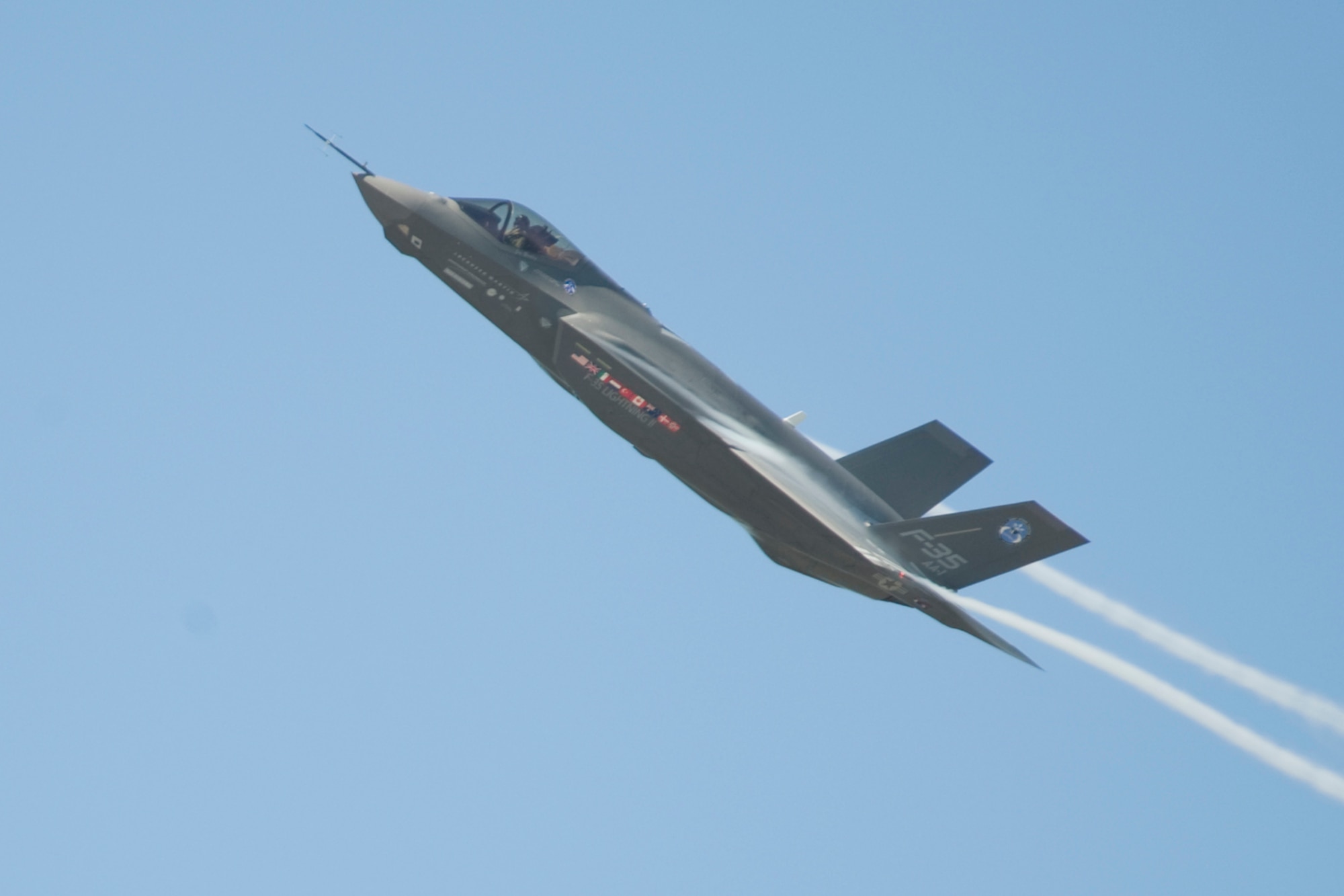 The Joint Strike Fighter test aircraft AA-1 banks over the Eglin Air Force Base flightline sending contrails streaming off the wings during its sortie April 23.  The aircraft’s first arrival at the base was to provide a showcase to Team Eglin and the local community.  Media and local community leaders saw and heard the aircraft in action during the sortie as well as got an up close view of it.  They were also shown a cockpit demo to see what it feels like to sit inside an F-35 and learn the pilot’s point of view.  Nine countries and three U.S. services have orders for the new aircraft and they all will pass through Eglin to learn to fly it.  The 33rd Fighter Wing will transition from an operational fighter unit into a joint training unit in October to educate and train the pilots.  The first of new fighters are scheduled to arrive March 2010. Courtesy photo.