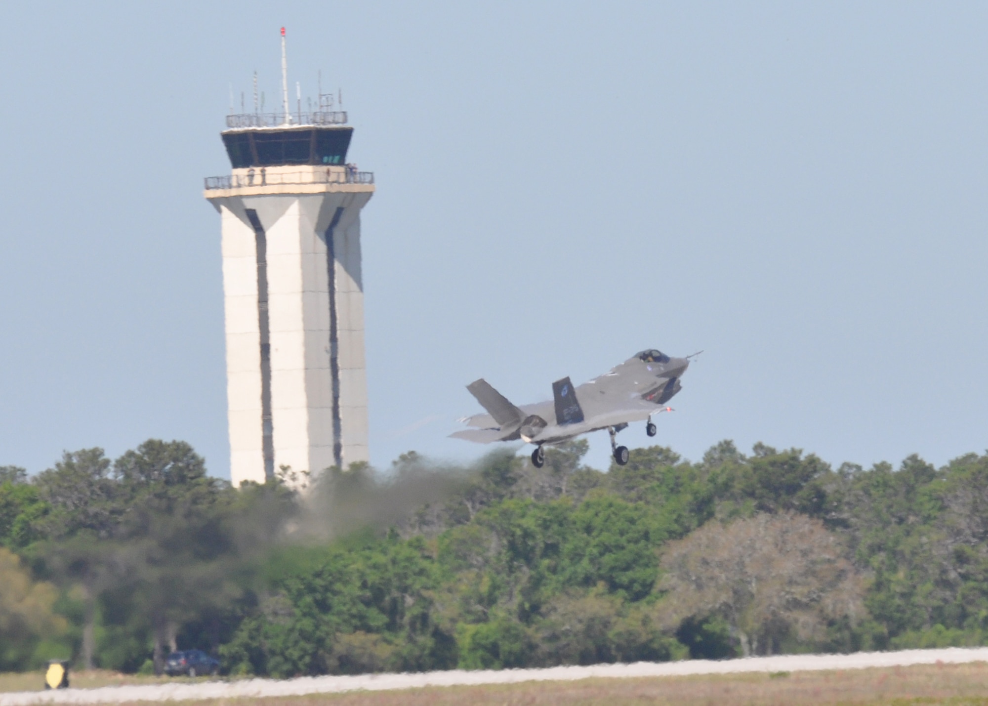 The Joint Strike Fighter test aircraft AA-1 performs a touch-and-go over the Eglin Air Force Base runway April 23 during its sortie.  The aircraft’s first arrival at the base was to provide a showcase to Team Eglin and the local community.  Media and local community leaders saw and heard the aircraft in action during the sortie as well as got an up close view of it.  They were also shown a cockpit demo to see what it feels like to sit inside an F-35 and learn the pilot’s point of view.  Nine countries and three U.S. services have orders for the new aircraft and they all will pass through Eglin to learn to fly it.  The 33rd Fighter Wing will transition from an operational fighter unit into a joint training unit in October to educate and train the pilots.  The first of new fighters are scheduled to arrive March 2010. U.S. Air Force photo/Samuel King Jr.
