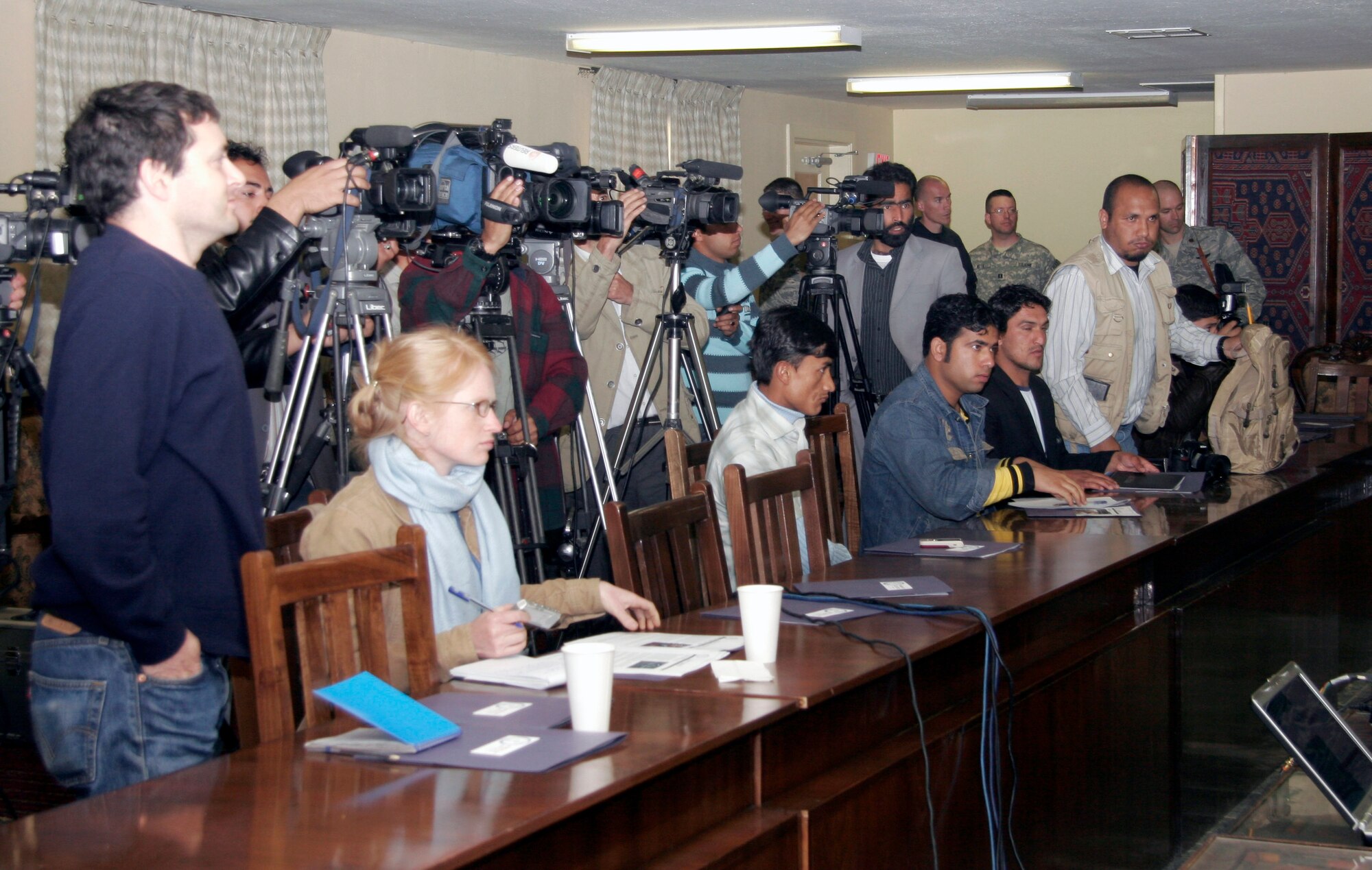 Afghan media record Lt. Gen. Gary North, Combined Forces Air Component commander for Southwest Asia, as he answers questions at his news conference during "Bagram Media Days" April 19. (U.S. Air Force photo/Col. August Schalkham)