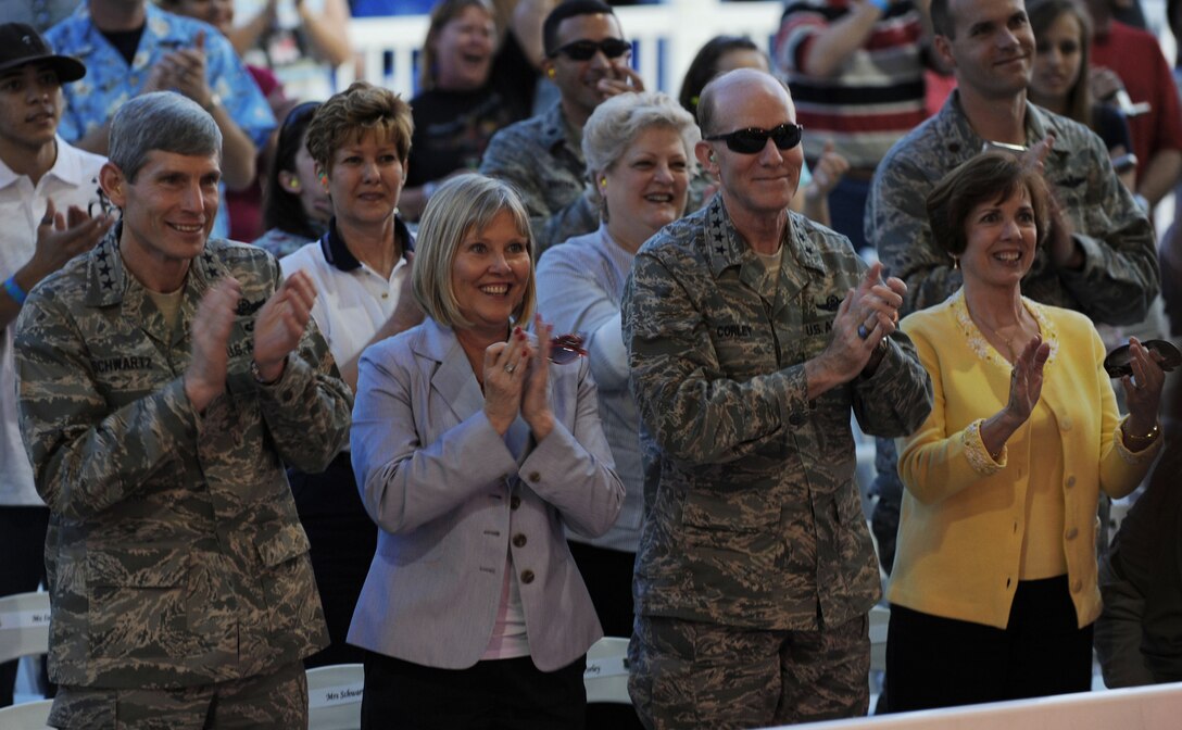 Gen. Norton Schwartz (from left), Air Force chief of staff, his wife Suzie, Gen. John D.W. Corley, Air Combat Command commander, and his wife Alice, enjoy the Kentucky Head Hunters concert during the Airpower over Hampton Roads event April 24. The first evening of the air show at Langley Air Force Base, Va., kicked off with a live concert from the country band, followed by a night air show and fireworks. (U.S. Air Force photo/Senior Airman Ashley Hawkins)