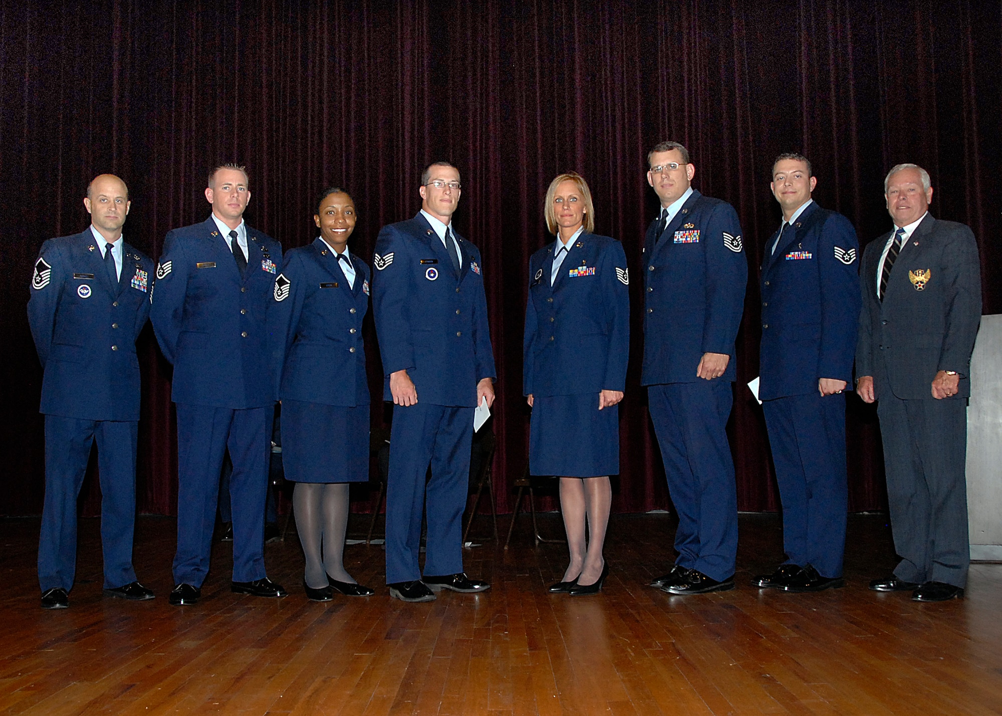 Seven Sheppard Airmen receive the Pitsenbarger award during the Sheppard Community College of the Air Force graduation at the base theater April 24. Pictured from left to right are, Master Sgt. Jeffrey Berndt, 366th Training Squadron, Staff Sgt. Clinton Dykes, 80th Operation Support Sqaudron, Master Sgt. Veronica Eddie, 80th OSS, Staff Sgt. Mickael O’Brien, 365th TRS, Tech. Sgt. Trisha Plummer, 383rd TRS, Tech. Sgt. Donald Remer, 982nd Maintenance Squadron, and Staff Sgt. Gregory Willet, 383rd TRS.  Retired Col. William Miller was the presenter of the award. (U.S. Air Force photo/ Harry Tonemah)