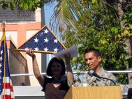 MIAMI -- Master Sgt. Alejandro Mion, 482nd Aircraft Maintenance Squadron F-16 crew chief, speaks to students and faculty at Vineland K-8 Center during the school's 50th Anniversary Celebration on April 24. Sergeant Mion presented the school and principal, Mrs. Mary Ann McLaren, a U.S. flag and certificate he had flown over the skies of Iraq in the school's honor. Sergeant Mion attended the Miami school from 1984 to 1987.  (Courtesy photo)