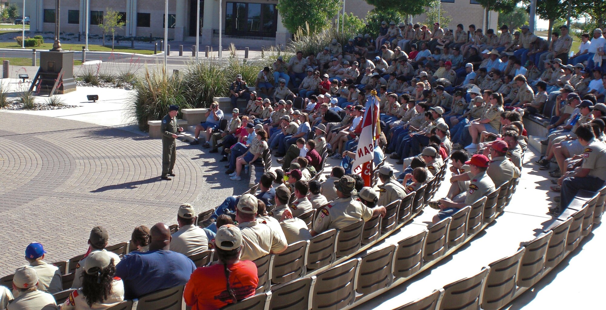 LAUGHLIN AIR FORCE BASE, Texas - Lt. Col. Stephen Moyinhan, 96th Flying Training Squadron, briefs, the Laughlin Camporee attendees of the Four Hero's of Laughlin AFB.  Following the briefing, three Boy scouts and one Venturing member retired the colors at Heritage Park April 18. (U.S. Air Force photo by Jeanette Quintanilla)