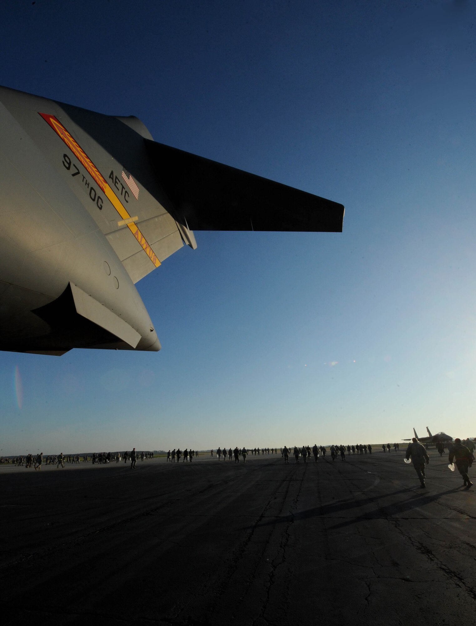 LANGLEY AIR FORCE BASE, Va. -- Airmen work to the clear the flightline of foreign object debris April 27. The post-air show FOD walk cleaned up what was left behind from the fun filled weekend of exhibiting aircraft and showing appreciation to the local community. (U.S. Air Force photo/Airman Rebecca Montez)