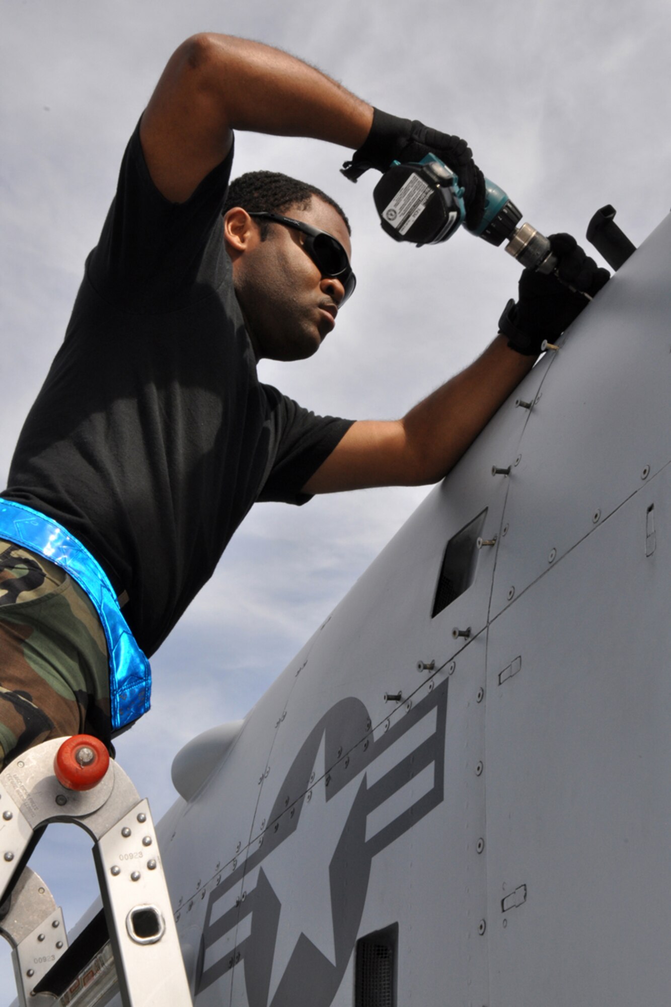 Staff Sgt. Davarick Pickens, avionics specialist, 717th Aircraft Maintenance Squadron, Barksdale Air Force Base, La., opens a panel to perform a maintenance check on an A-10 Thunderbolt March 30, 2009. Airmen from the 717th AMXS maintained A-10 jets from the 47th Fighter Squadron at Barksdale AFB, while they supported training evolutions for Joint Terminal Attack Controllers with the 15th Air Support Operations Squadron at Fort Stewart, Ga. (US Air Force photo/Tech. Sgt. Jeff Walston)