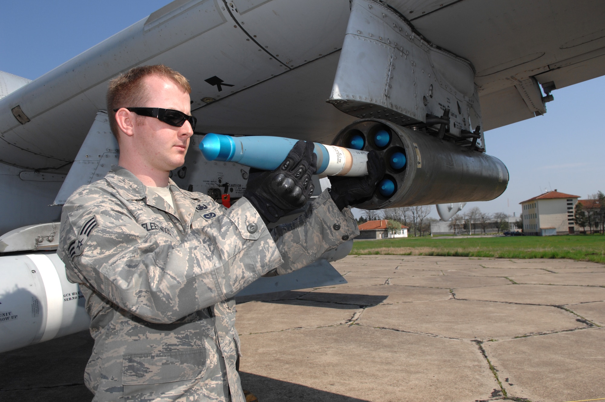 BEZMER AIR BASE, Bulgaria – Senior Airman Bryan Fleetwood, 52nd Civil Engineer Squadron Explosive Ordinance Disposal team, removes a training rocket from an A-10 aircraft.  Airman Fleetwood deployed to Bezmer Air Base, Bulgaria, to support a joint U.S. and Bulgarian Air Forces training exercise. (U.S. Air Force photo by Master Sgt. Bill Gomez) 