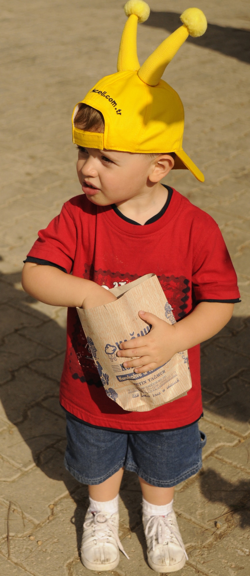 Jay, son of Tech Sgt. Justin Long, 39th Security Forces Squadron, and wife Natalie Long, observes the large crowd while having a snack at the Turkish Children’s Festival April 23, 2009 at Arkadas Park at Incirlik Air Base, Turkey.  The celebration is a day hosted annually for the children of Turkey, showcasing traditional dances led by the children and many cultural aspects to share with the community of Incirlik.  (U.S. Air Force photo/Airman 1st Class Amber Russell)