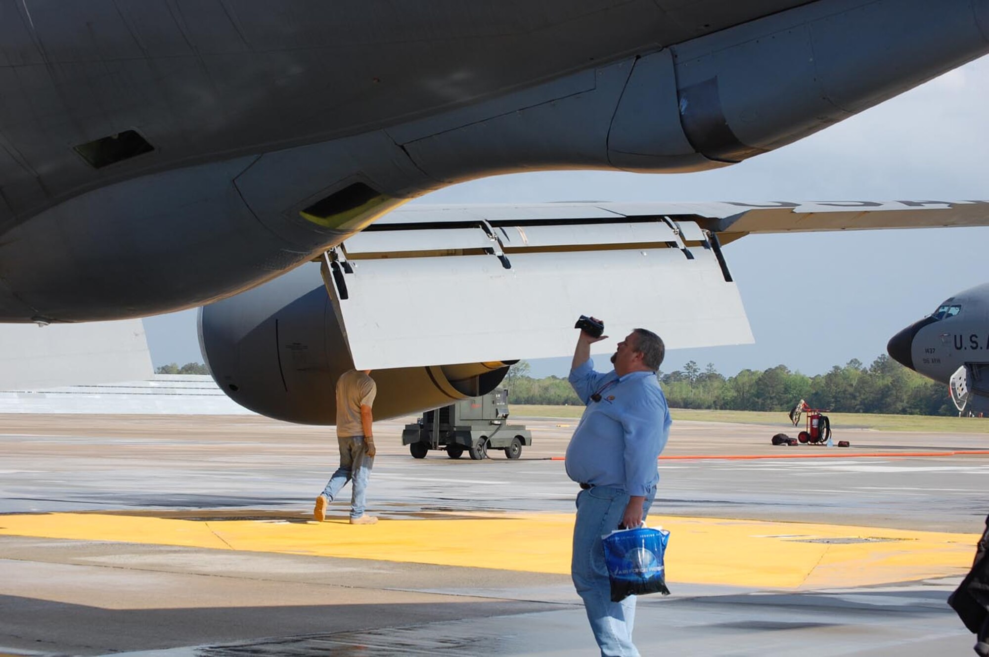 SEYMOUR JOHNSON AIR FORCE BASE, N.C. -- A journalist gets video of the boom pod area from outside the KC-135 Stratotanker on April 20, 2009. Ten various media outlets joined the 916th Air Refueling Wing, Air Force Reserve, for a special media flight to help promote the Wings Over Wayne Air Show.