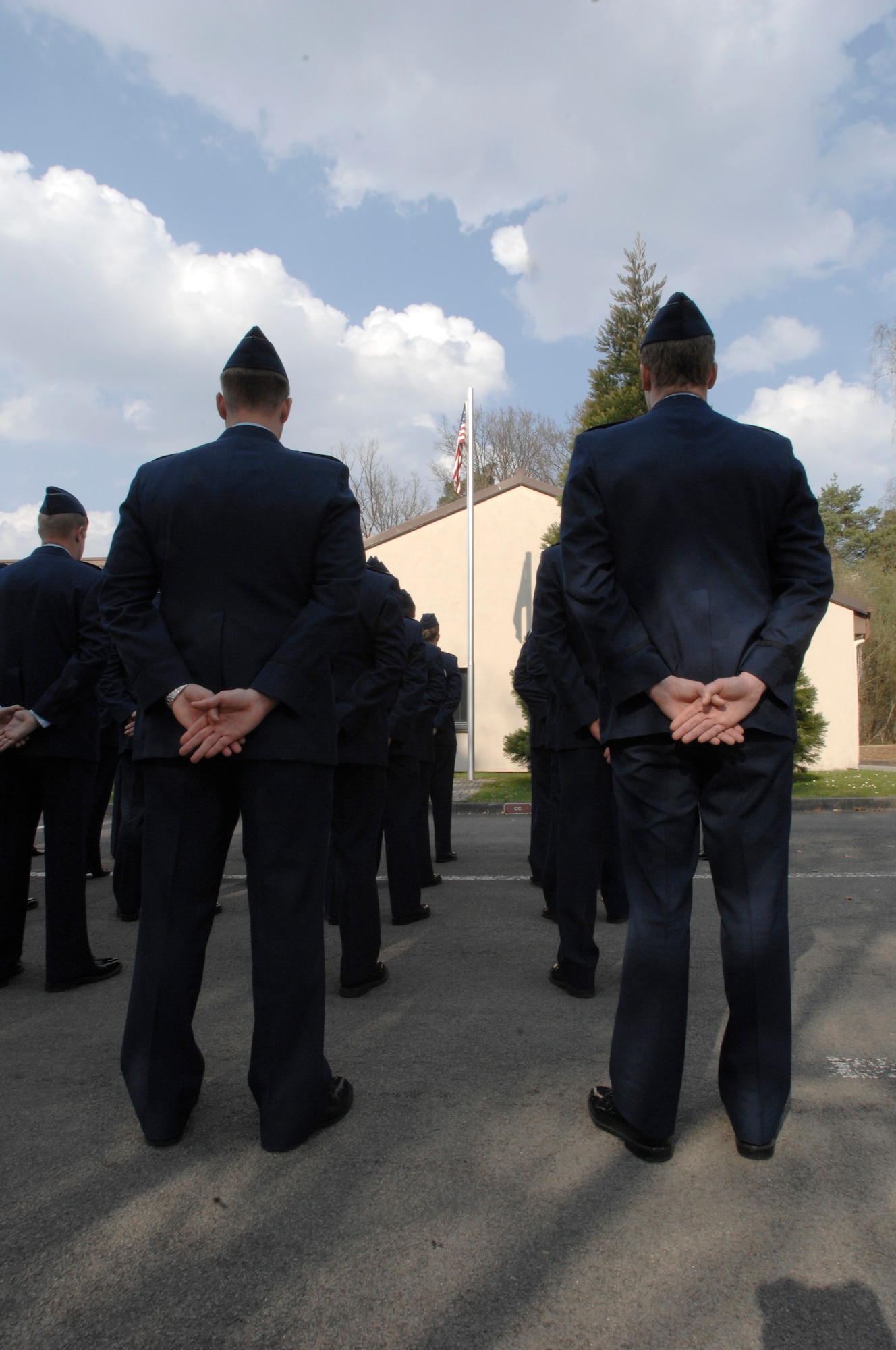 U.S. Air Force Airmen from the 76th Airlift Squadron stand in formation during the memorial service for the tragic loss of Implementation Force (IFO)-21, April 6, 2009, Ramstein Air Base, Germany.  The 76th AS hosts this memorial service every year.  (U.S. Air Force photo by Senior Airman Amber Bressler)