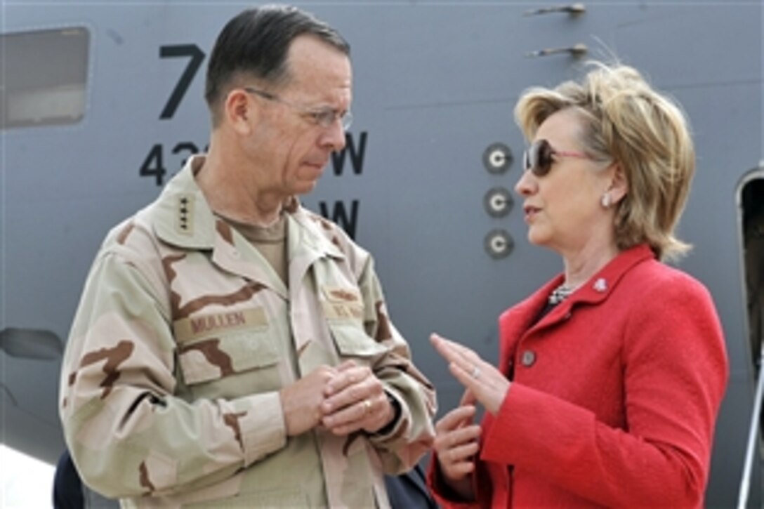 U.S. Navy Adm. Mike Mullen, chairman of Joint Chiefs of Staff, left, talks with Secretary of State Hillary Clinton on the flight line shortly after she arrived on Sather Air Base, Baghdad, Iraq, April 25, 2009. Clinton passed through Sather during an unannounced visit to meet with U.S. military leaders and top Iraqi government officials. Clinton also met with U.S. troops and Iraqi civilians during a town hall meeting at the U.S. Embassy in Iraq. 