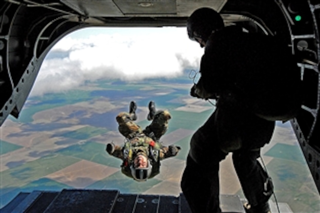 U.S. Air Force Tech. Sgt. Derrick Brooks back flips from an Oregon Army National Guard CH-47 Chinook helicopter at 7,200 feet during a jump demonstration in Pendleton, Ore., April 23, 2009.
Brooks is a pararescue jumper assigned to the 304th Rescue Squadron, Air Force Reserve.