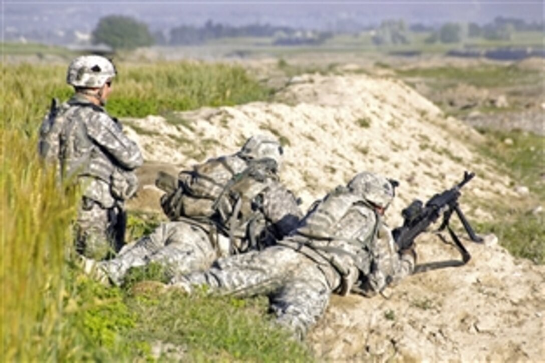 U.S. Army soldiers scan a wadi for suspicious traffic during a patrol near Combat Outpost Sabari, Afghanistan, April 25, 2009. The soldiers are assigned to the 25th Infantry Division's 1st Battalion, Company D, 501st Infantry Regiment, 4th Brigade Combat Team. A wadi is an Arabic term referring to a valley that may contain water during times of heavy rain.