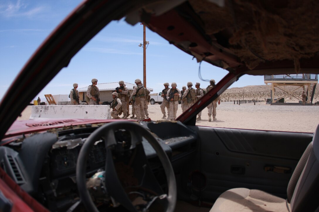 Marines with Company C, 1st Tank Battalion prepare to assault a building during their training in military operations on urban terrain Combat Center’s Range 111, April 28.