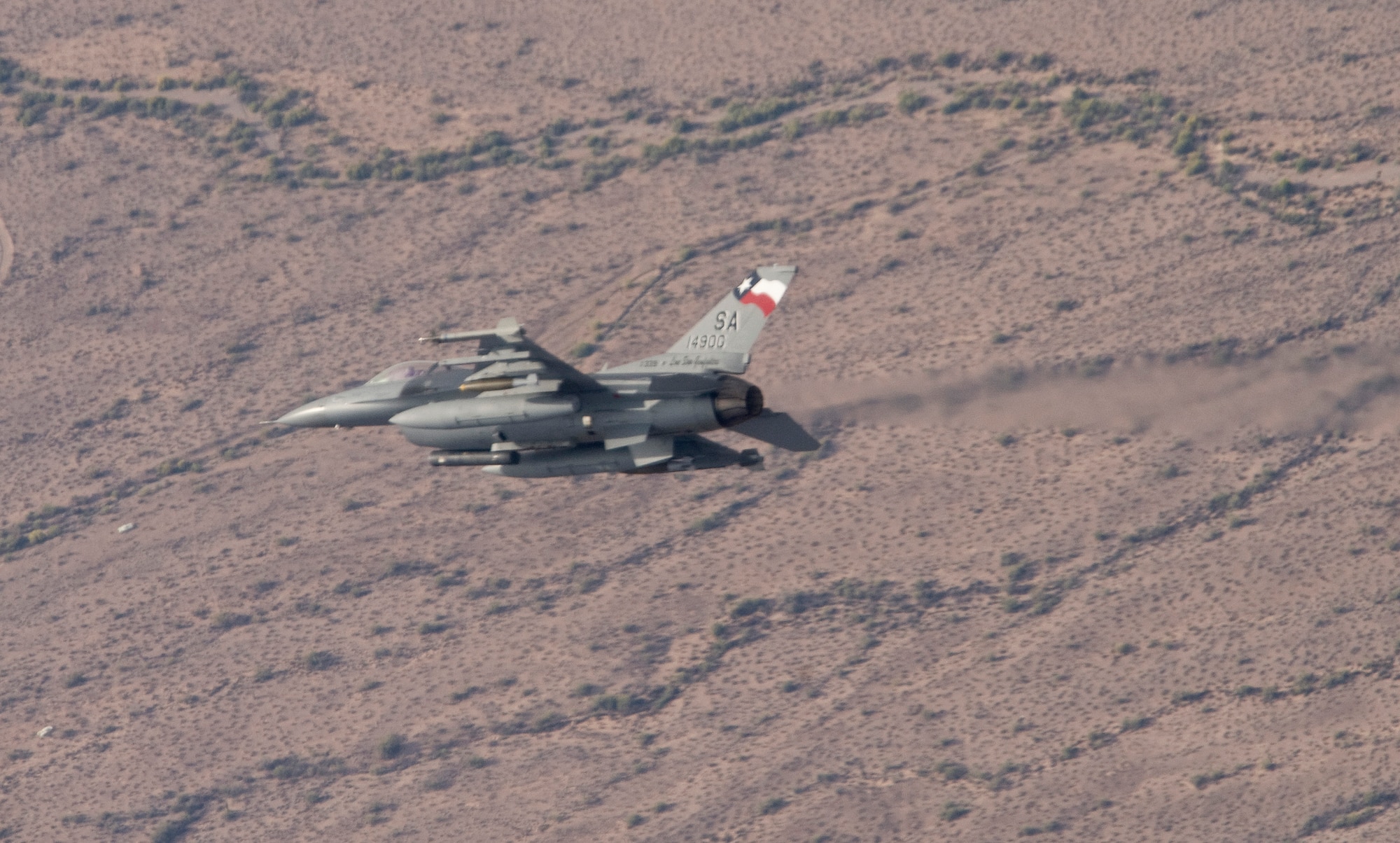 A student pilot with the 149th Fighter Wing maneuvers his F-16 Fighting Falcon into the target area during live munitions drops on the Barry Goldwater Bombing Range April 24 near Tucson, Ariz. (U.S. Air Force photo/Master Sgt. Jack Braden)