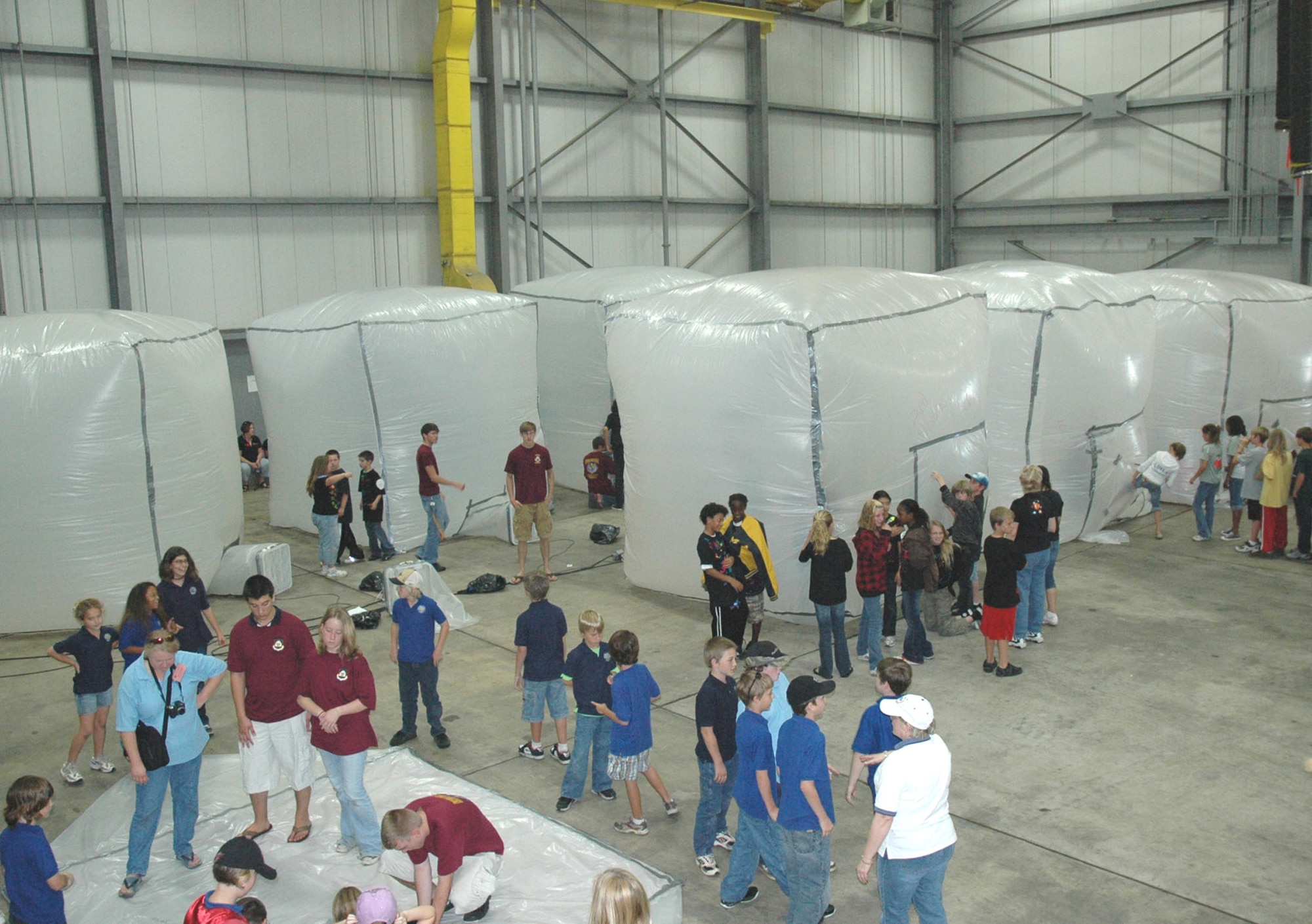 Fifth-grade students from three area elementary schools, along with teachers and volunteers, transform Duke Field's fuel cell hangar into Marsville, a conceptual Martian colony. Held at Eglin Air Force Base the past 14 years, the 919th SOW answered the call when hangar space there was temporarily unavailable.  The educational event challenges students' creativity and intellect in solving problems associated with establishing a Martian colony with limited resources. (U.S. Air Force photo/Dan Neely)