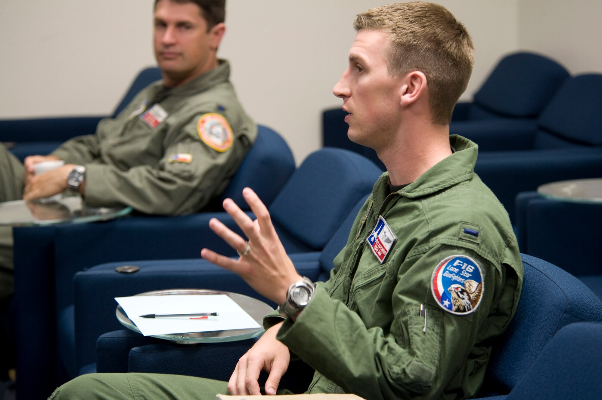 1st Lt. Scott Kotowski (front) answers questions about safety procedures during a mass brief April 23 at Davis Monthan Air Force Base, Ariz.  He is one of nine active-duty student pilots participating in Exercise Coronet Cactus. Lieutenant Kotowski is assigned to the 149th Fighter Wing in San Antonio. (U.S. Air Force photo/Master Sgt. Jack Braden)