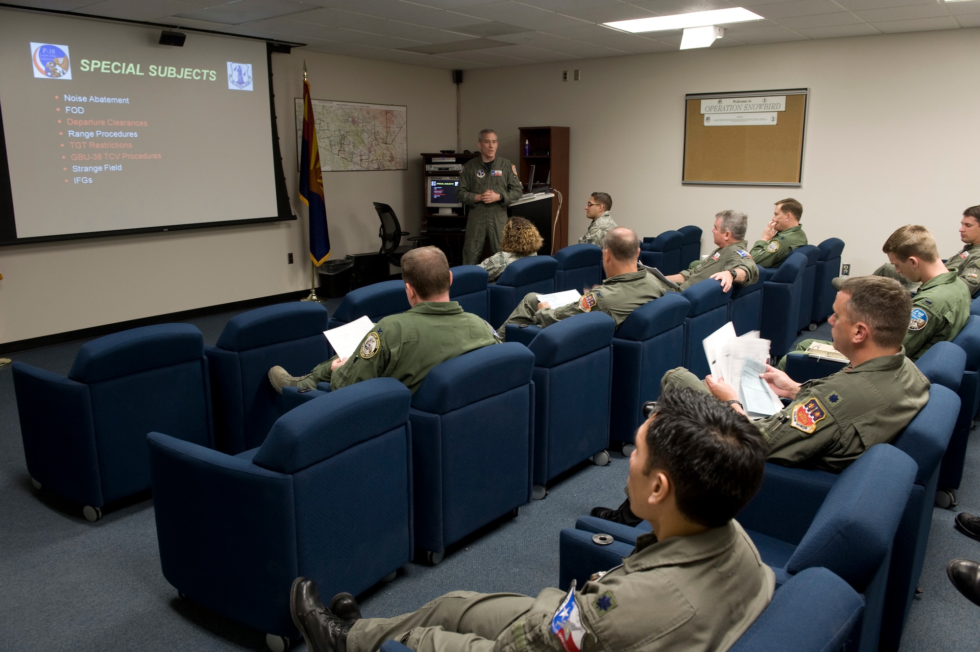 Pilots with the Air National Guard's 149th Fighter Wing from San Antonio attend a mass mission brief prior to their sorties April 23 at Davis-Monthan Air Force Base, Ariz. The pilots are a mix of instructors and students participating in Exercise Coronet Cactus. (U.S. Air Force photo/Master Sgt Jack Braden)