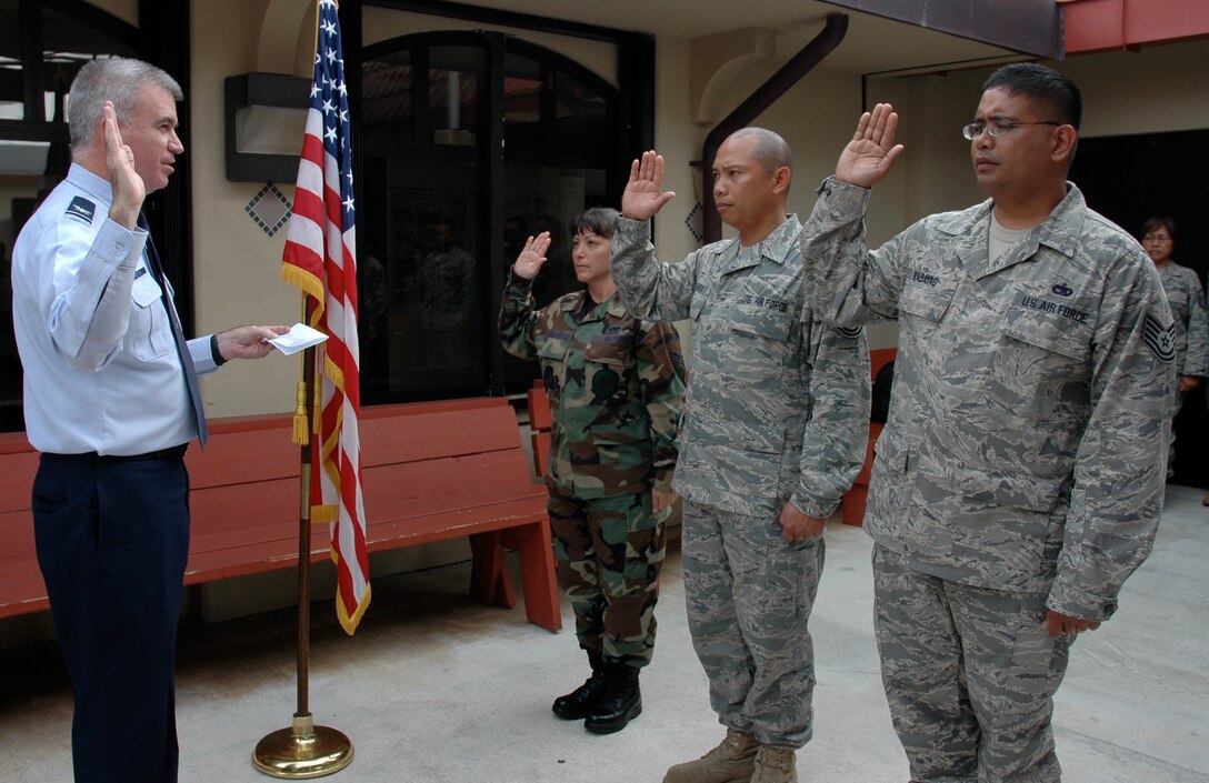 Col. Robert "Randy" Huston, 624th Regional Support Group commander, reenlisted three Air Force Reservists at Andersen Air Force Base, Guam, April 26 during drill weekend.  From the left are Senior Airman Candy Strachota, Technical Sergeants Jesse Bamba and John Mabayag, all from the 44th Aerial Port Squadron.  The 44th APS and the 724th Aeromedical Staging Flight, both based at Andersen, fall under the 624th RSG.  The 624th RSG is the largest Air Force Reserve presence in the Pacific providing the combatant commander more than 650 combat-ready Airmen who specialize in aerial port, aeromedical staging and civil engineering operations for
worldwide employment.   