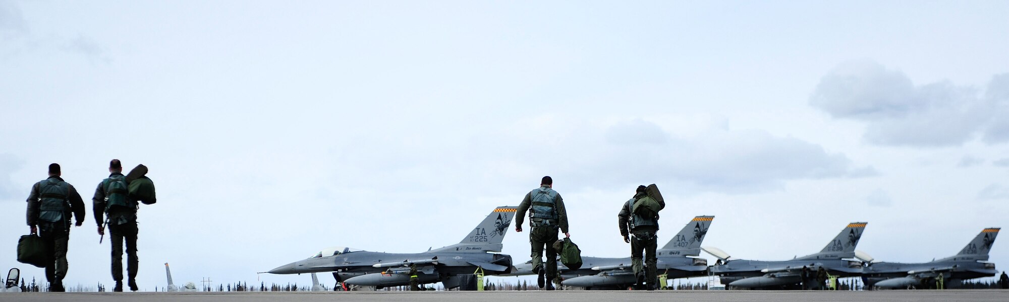 Pilots of the 124th Fighter Squadron, Des Moines, Iowa, step to their F-16 Fighting Falcons during RED FLAG-Alaska 09-2, April 24, 2009, Eielson Air Force Base, Alaska.  This exercise enables aviation units to sharpen their skills by flying 10 simulated combat sorties in a realistic threat environment.  (U.S. Air Force Photo/Senior Airman Jonathan Snyder) (Released)
