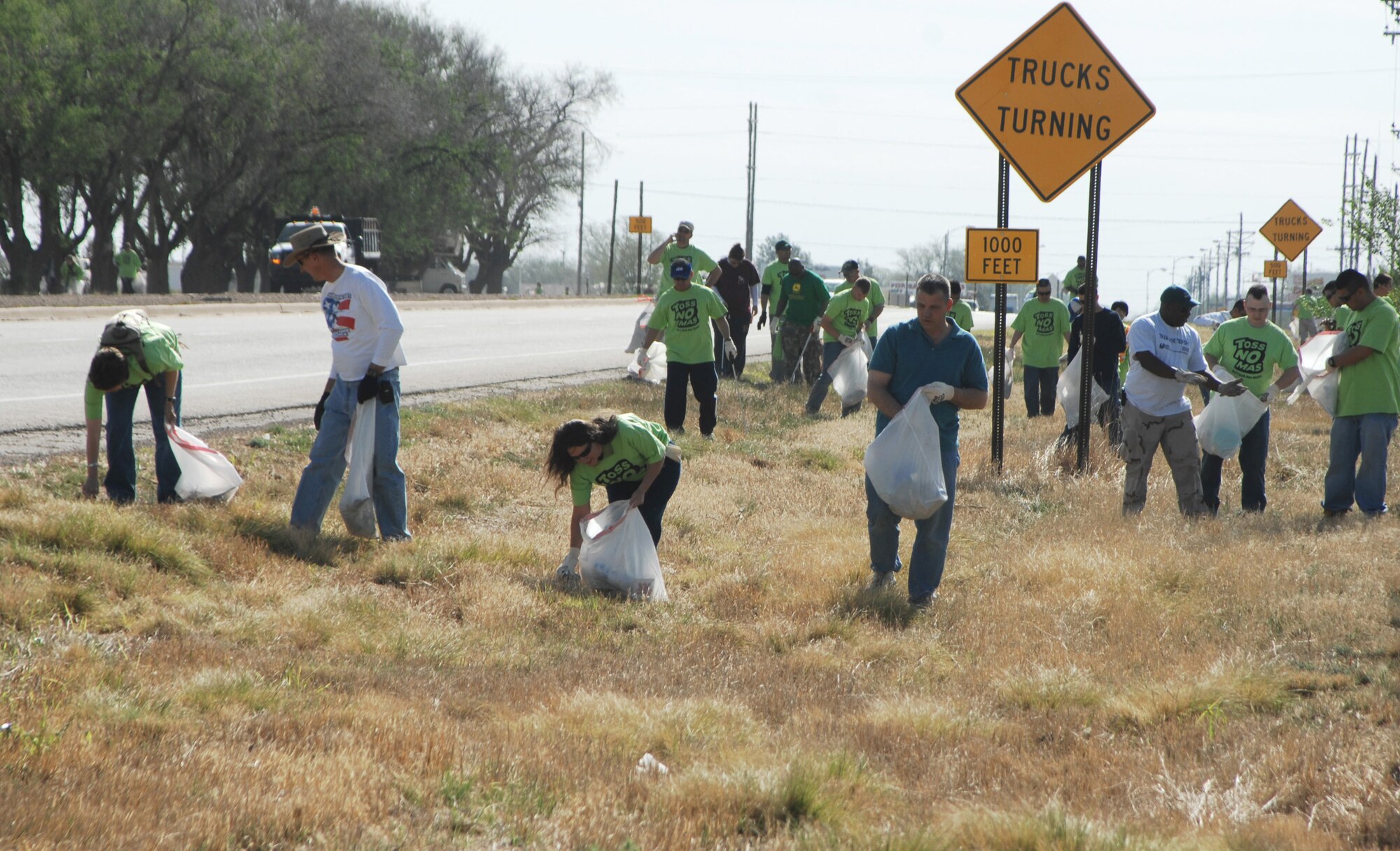 CANNON AIR FORCE BASE, N.M. -- Airmen collect trash on Highway 60/84 during the Great American Cleanup April 25.More than 129 tons of garbage was collected during the event. (Air Force photo/Greg Allen)