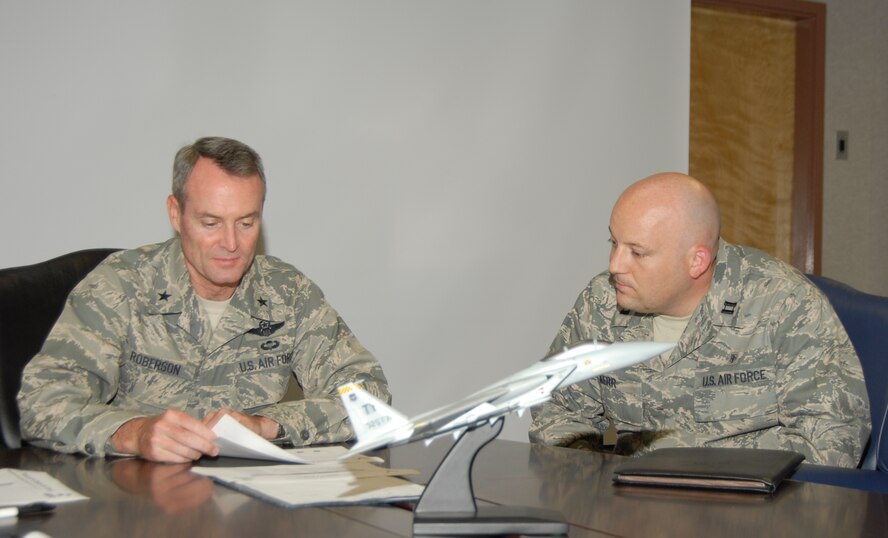 Capt. Eric Kerr, 325th Medical Group practice manager, shadows Brig. Gen. Roberson, 325th Fighter Wing commander, during the commander’s staff meeting here today. Captain Kerr is a business manager supporting high quality, accessible, cost effective healthcare services. Captain Kerr spent the day with General Roberson as part of the Commander’s Shadow Program. He has five years in the military and is a native of Owasso, Okla.  (U.S. Air Force photo by Robin Walters)